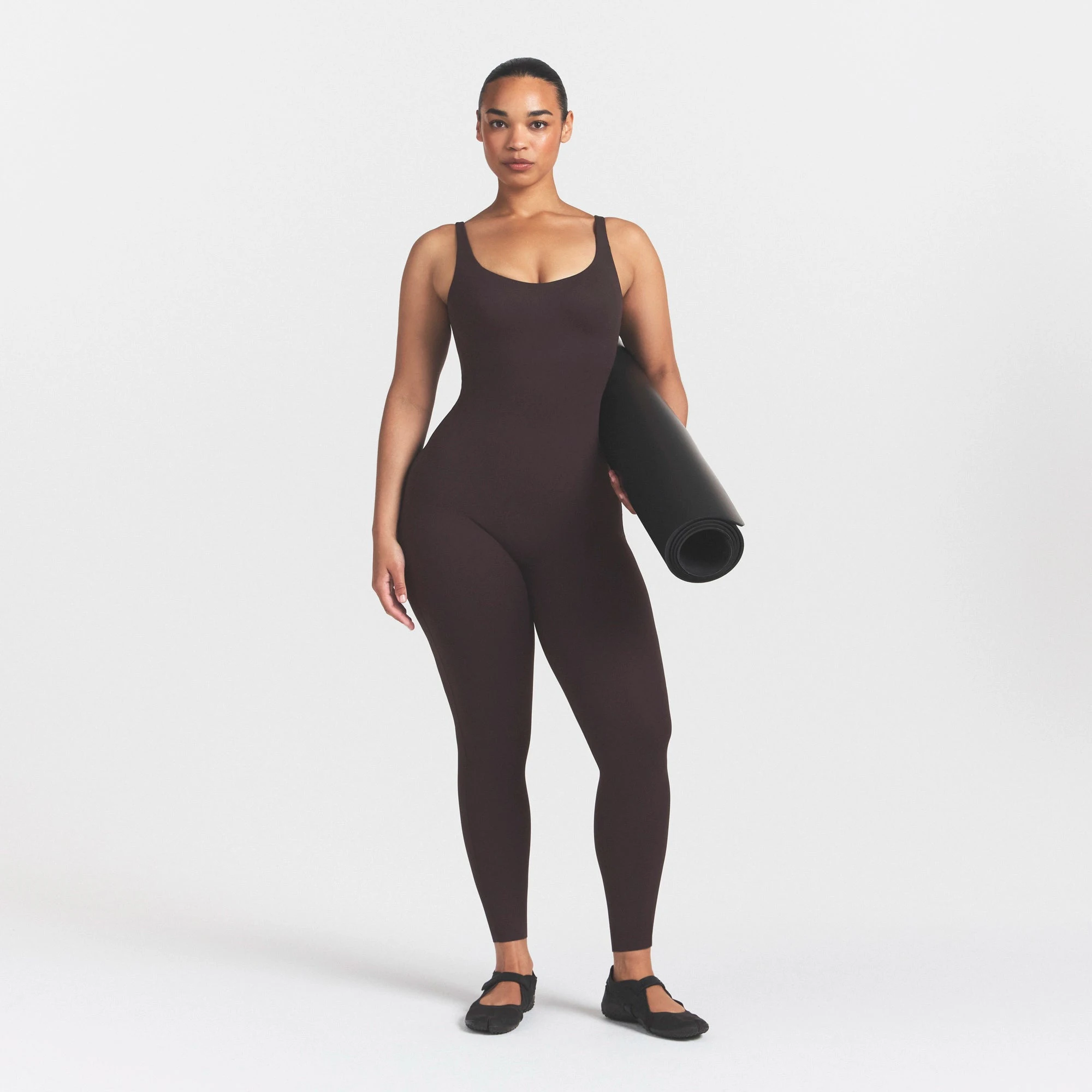 NikeSKIMS STUDIO STRETCH LONG 29" ONE PIECE | DARK ROASTON A MODEL FRONT