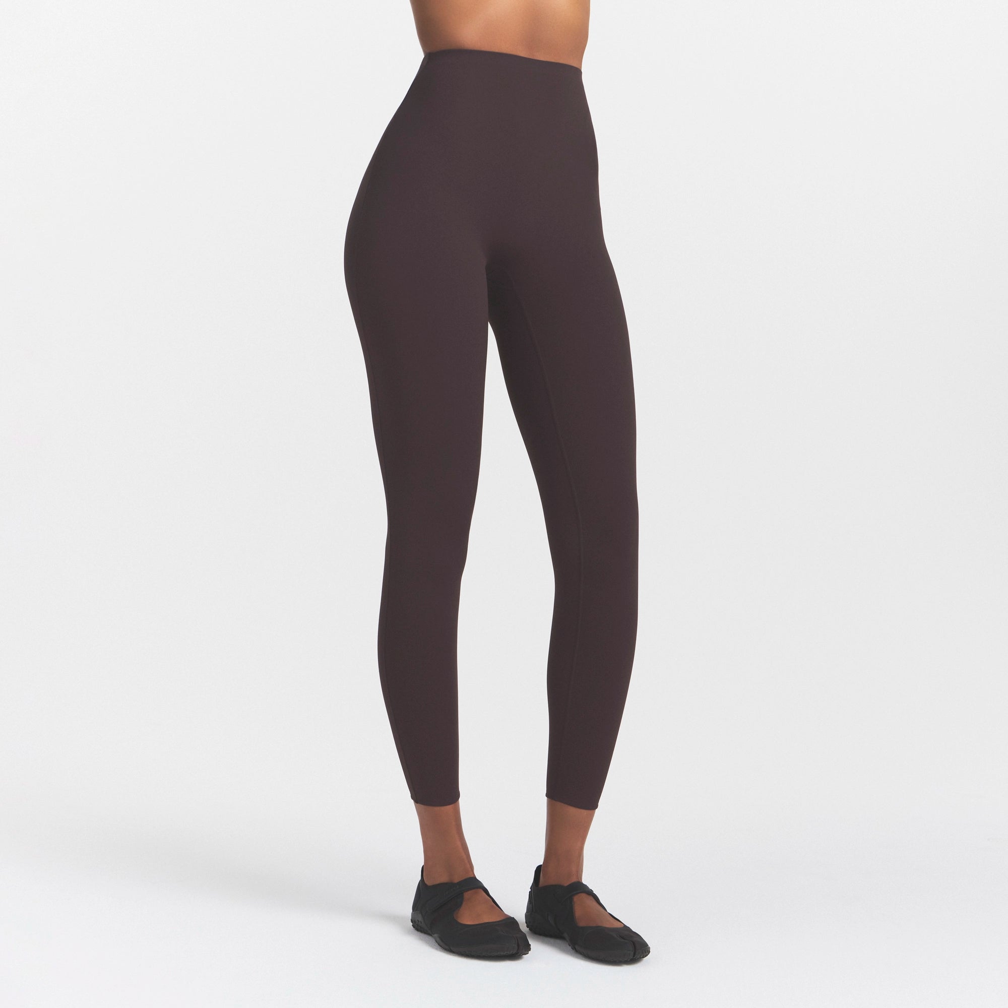 NikeSKIMS STUDIO STRETCH 26" LEGGING | DARK ROASTON A MODEL FRONT 