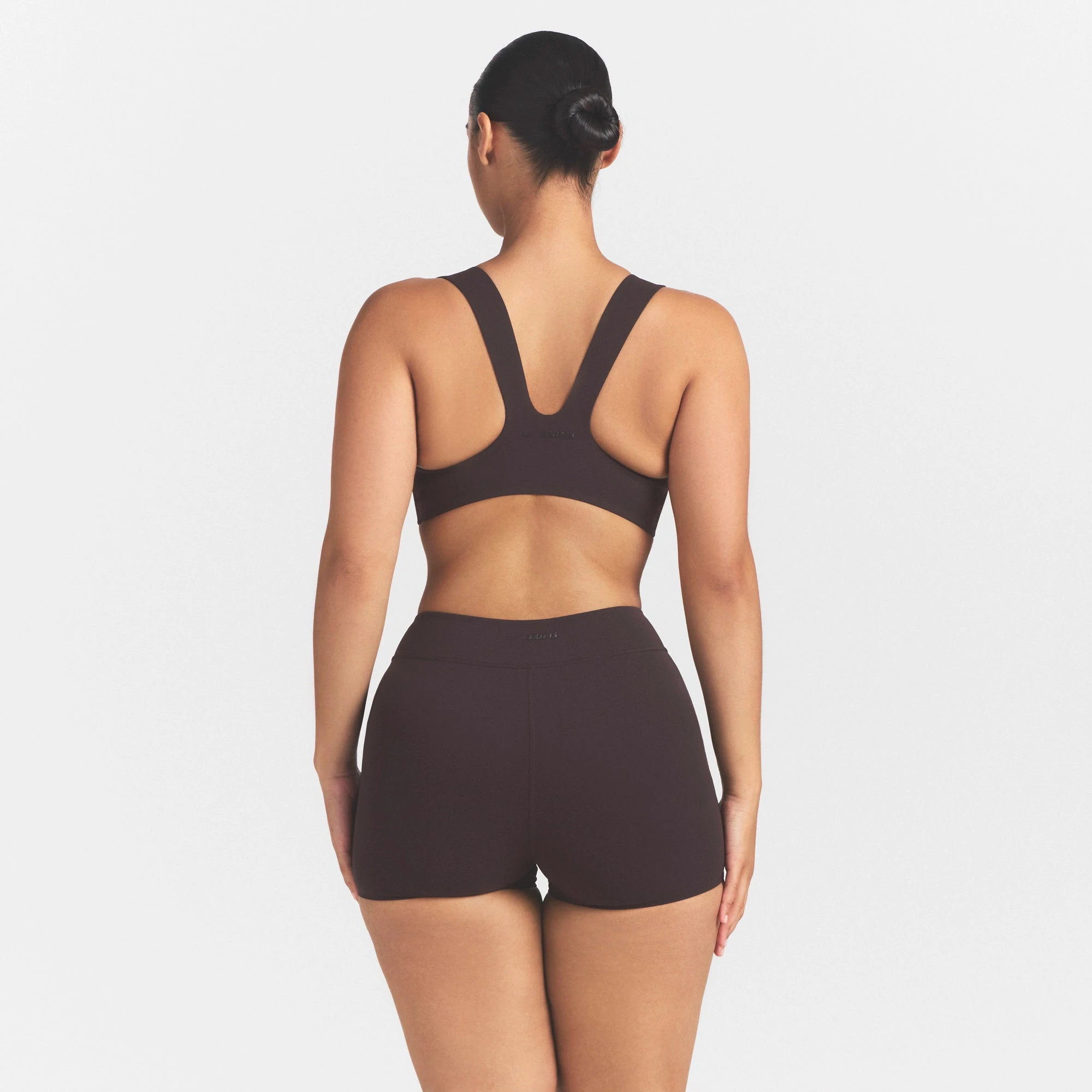NikeSKIMS STUDIO STRETCH DIP FRONT 2" SHORT | DARK ROASTON A MODEL FRONT VIEW @ | FOCUS: 0.0, 1.0, 0.9