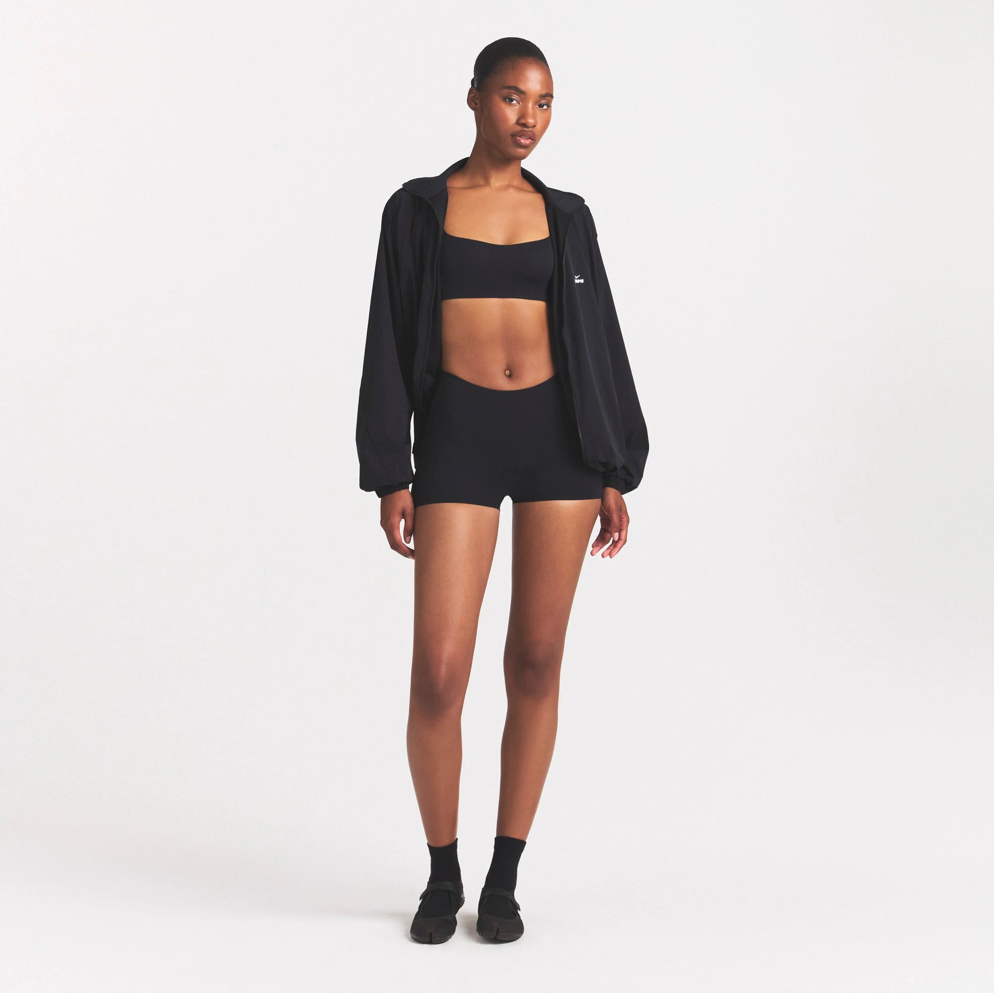 NikeSKIMS STUDIO STRETCH DIP FRONT 2" SHORT | OBSIDIANON A MODEL FRONT