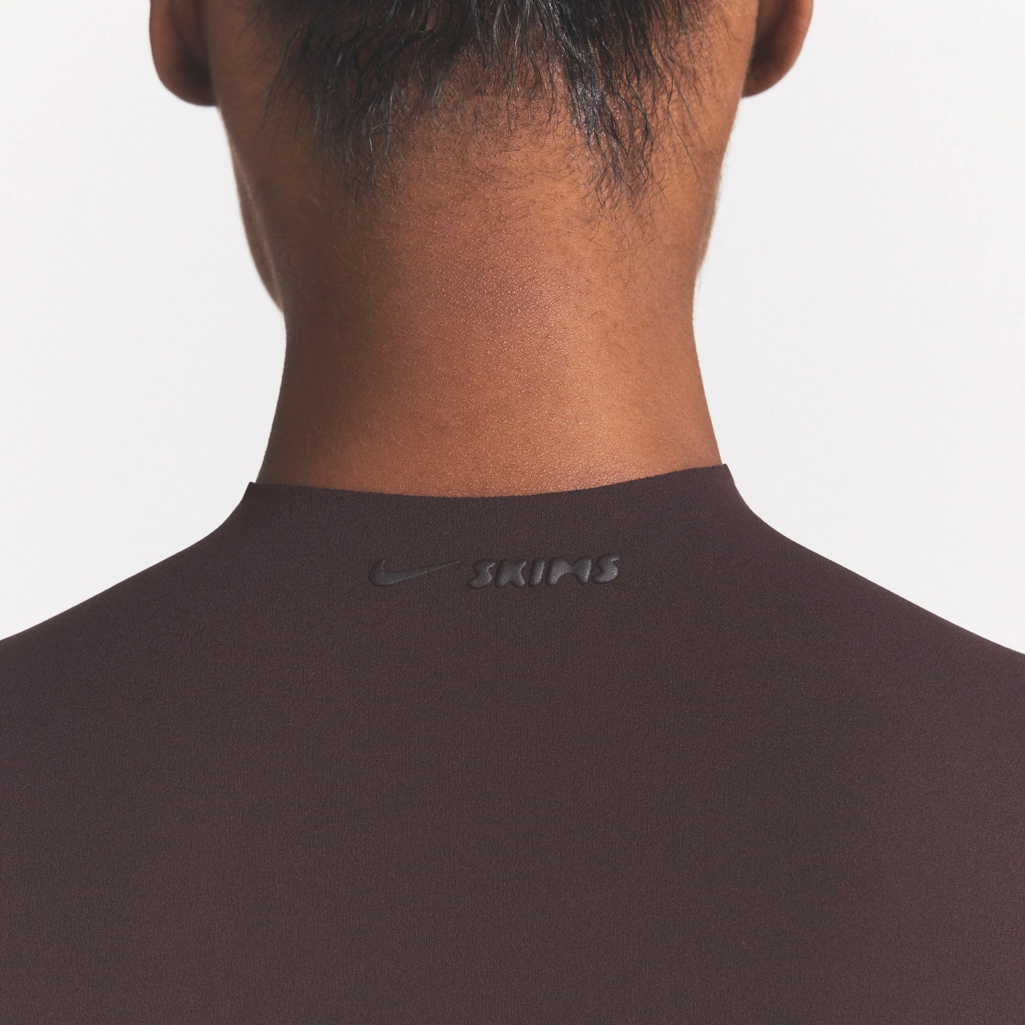 NikeSKIMS STUDIO STRETCH MOCK NECK BRA | DARK ROASTON A MODEL FRONT VIEW @ | FOCUS: 0.0, 1.0, 0.9