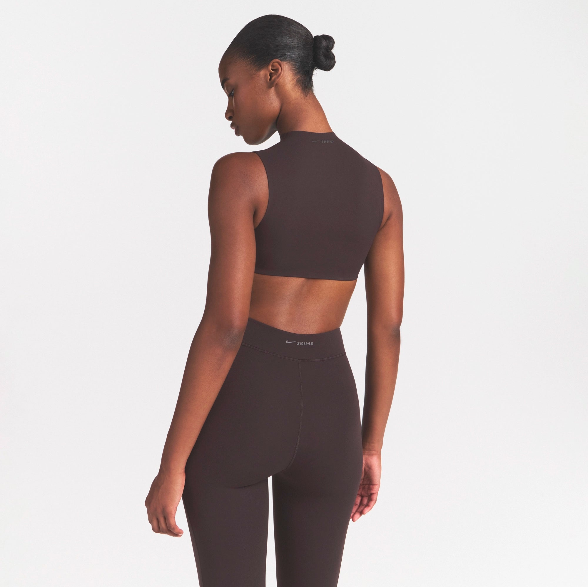 NikeSKIMS STUDIO STRETCH MOCK NECK BRA | DARK ROASTON A MODEL FRONT 