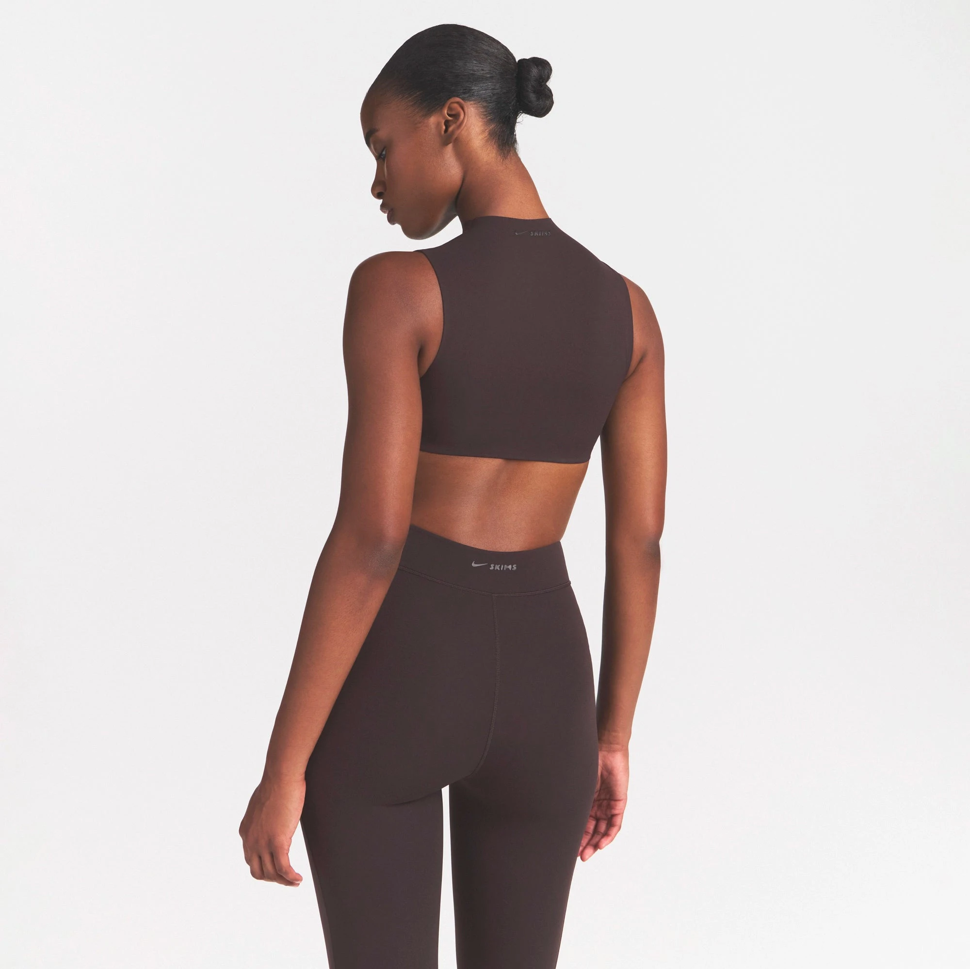 NikeSKIMS STUDIO STRETCH MOCK NECK BRA | DARK ROASTON A MODEL FRONT VIEW @ | FOCUS: 0.0, 1.0, 0.9
