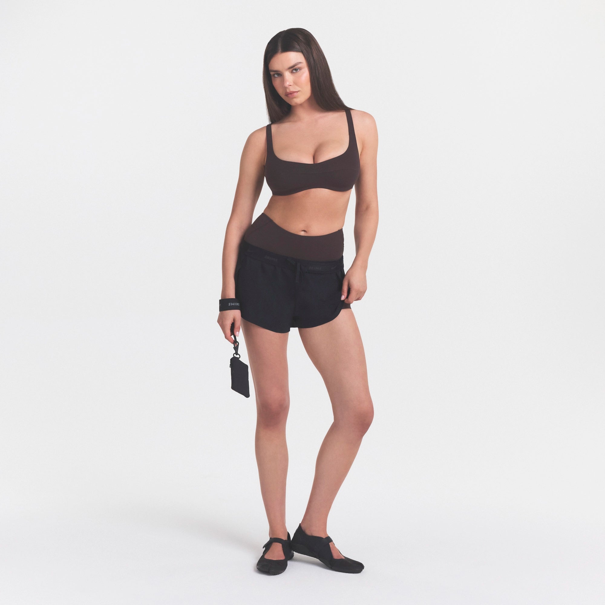 NikeSKIMS STUDIO STRETCH  SEAM FRONT MICRO BRA | DARK ROASTON A MODEL FRONT 