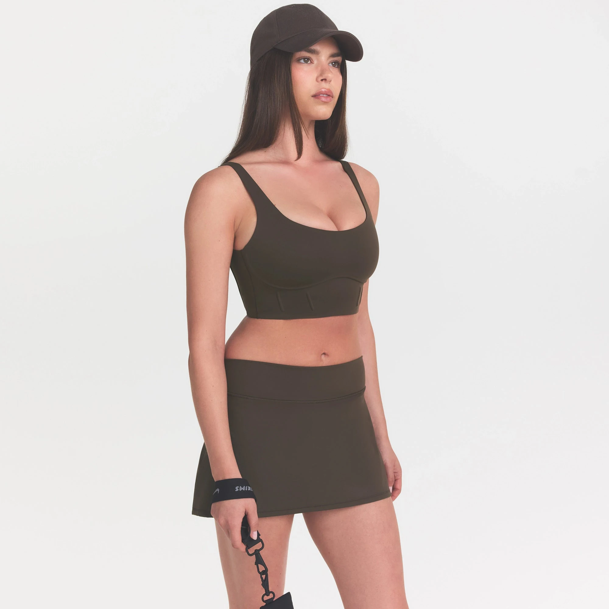 NikeSKIMS MATTE CORSET LONGLINE BRA | DARK SEPIA ON A MODEL