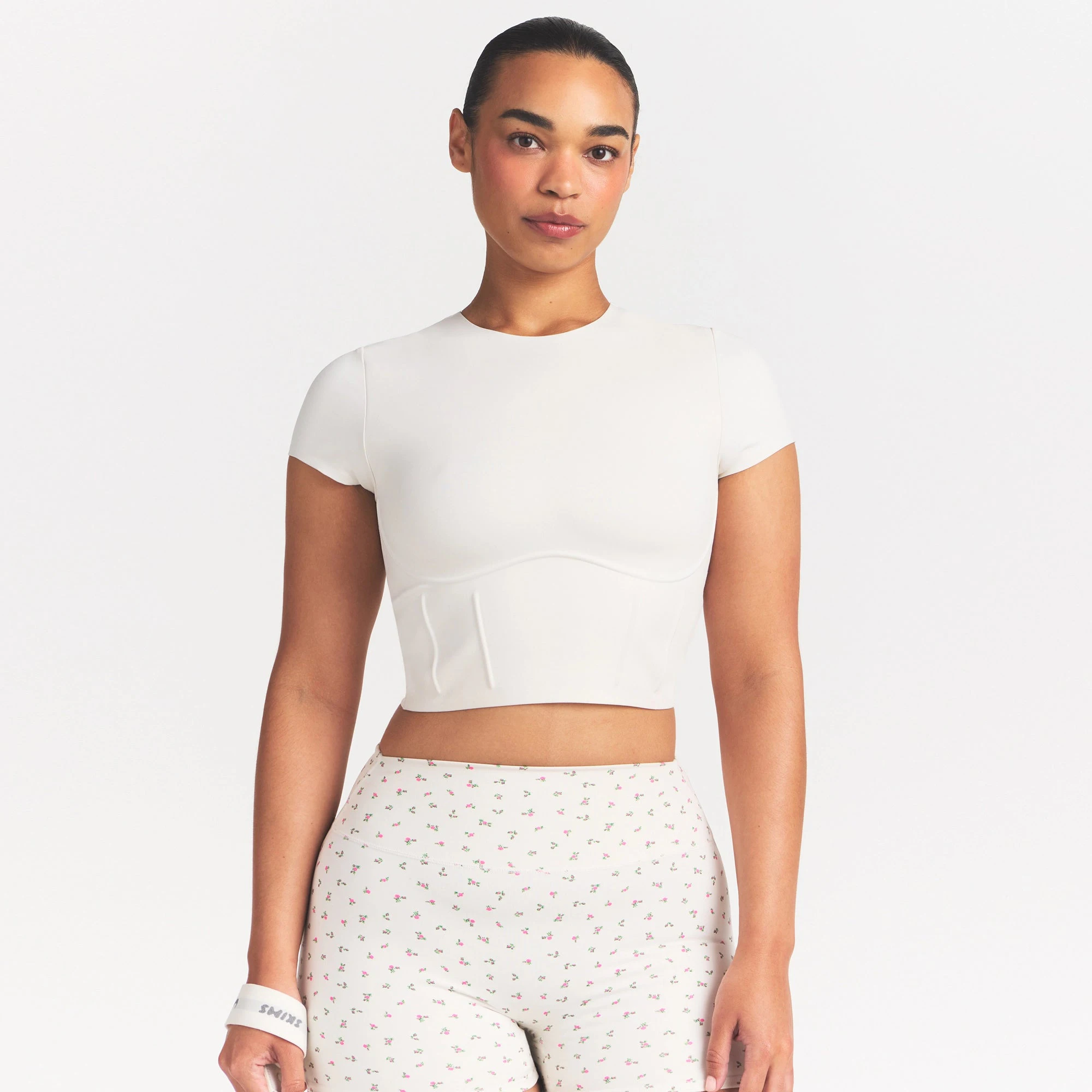 NikeSKIMS MATTE CORSET CROP TOP | IVORY ON A MODEL