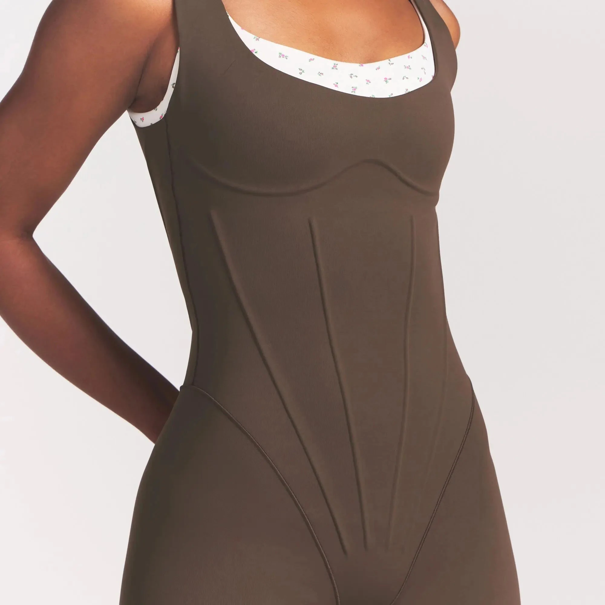 NikeSKIMS MATTE CORSET 2" ONE PIECE | DARK SEPIA ON A MODEL VIEW @ | FOCUS: 0.0, 1.0, 0.9