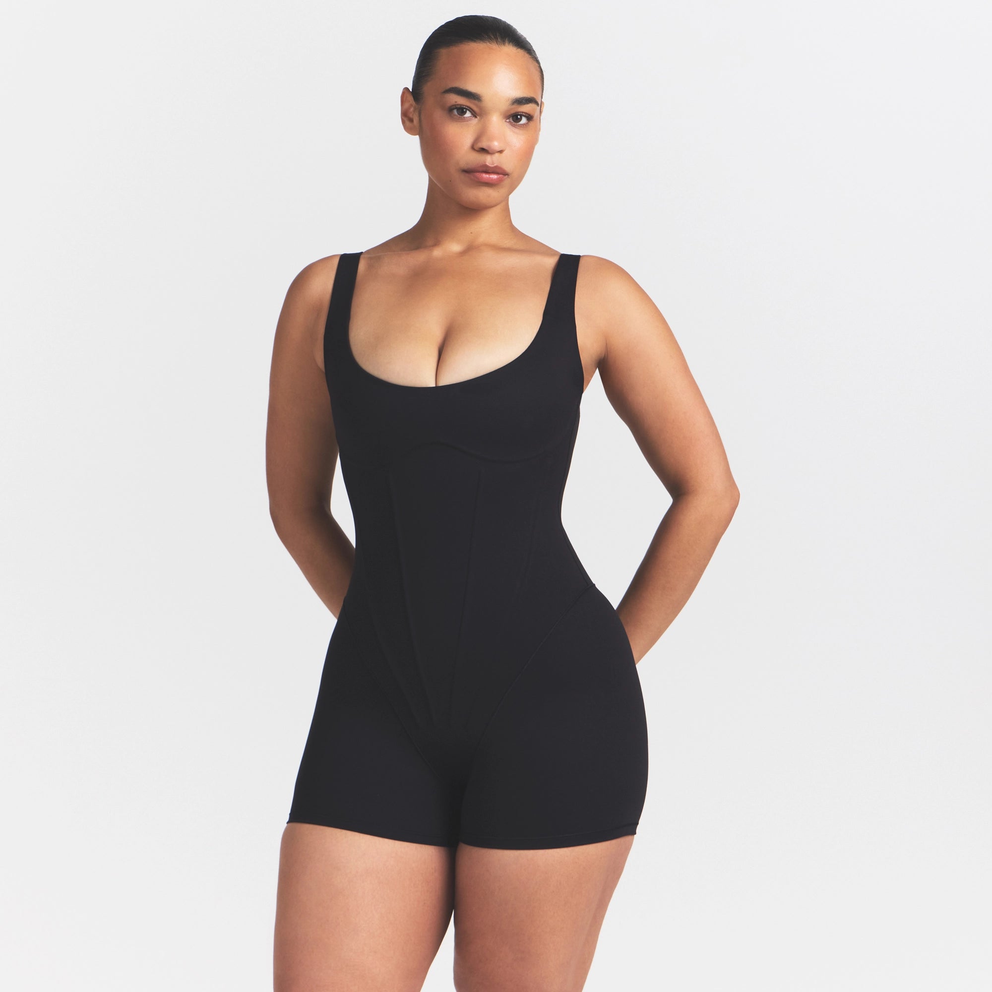 NikeSKIMS MATTE CORSET 2" ONE PIECE | OBSIDIAN ON A MODEL 