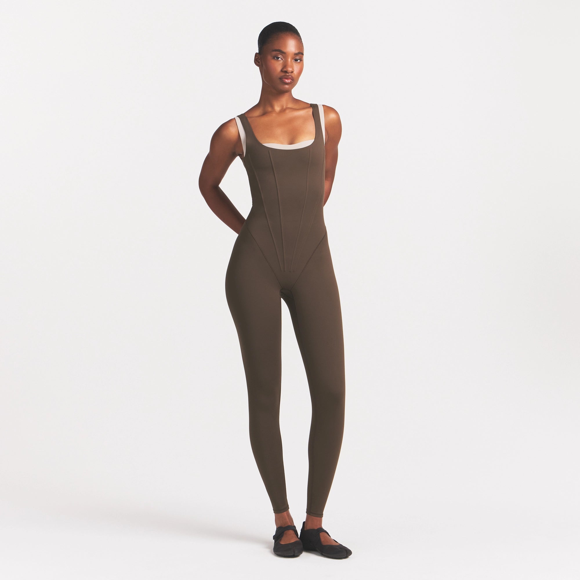 NikeSKIMS MATTE CORSET 29" ONE PIECE | DARK SEPIA ON A MODEL VIEW @ | FOCUS: 0.0, 1.0, 0.9