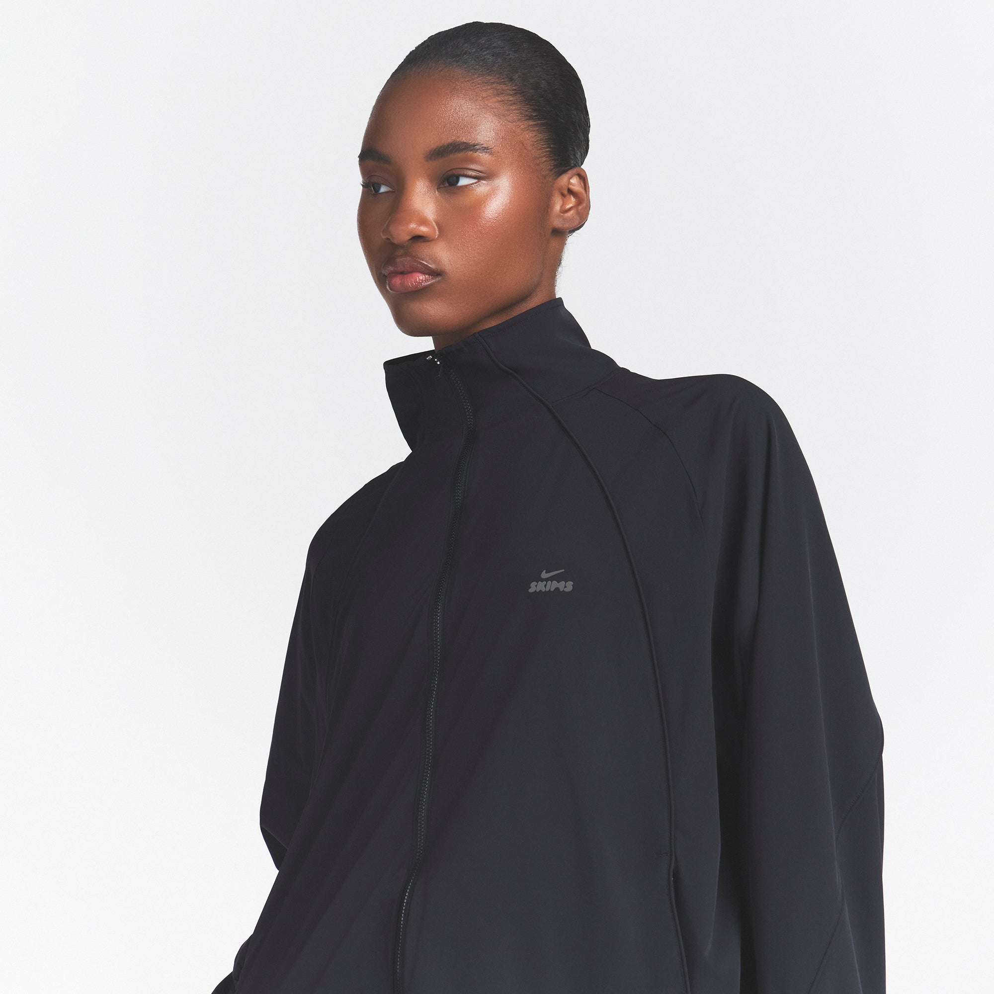 NikeSKIMS STRETCH NYLON OVERSIZED TRACK JACKET | OBSIDIAN | SKIMS