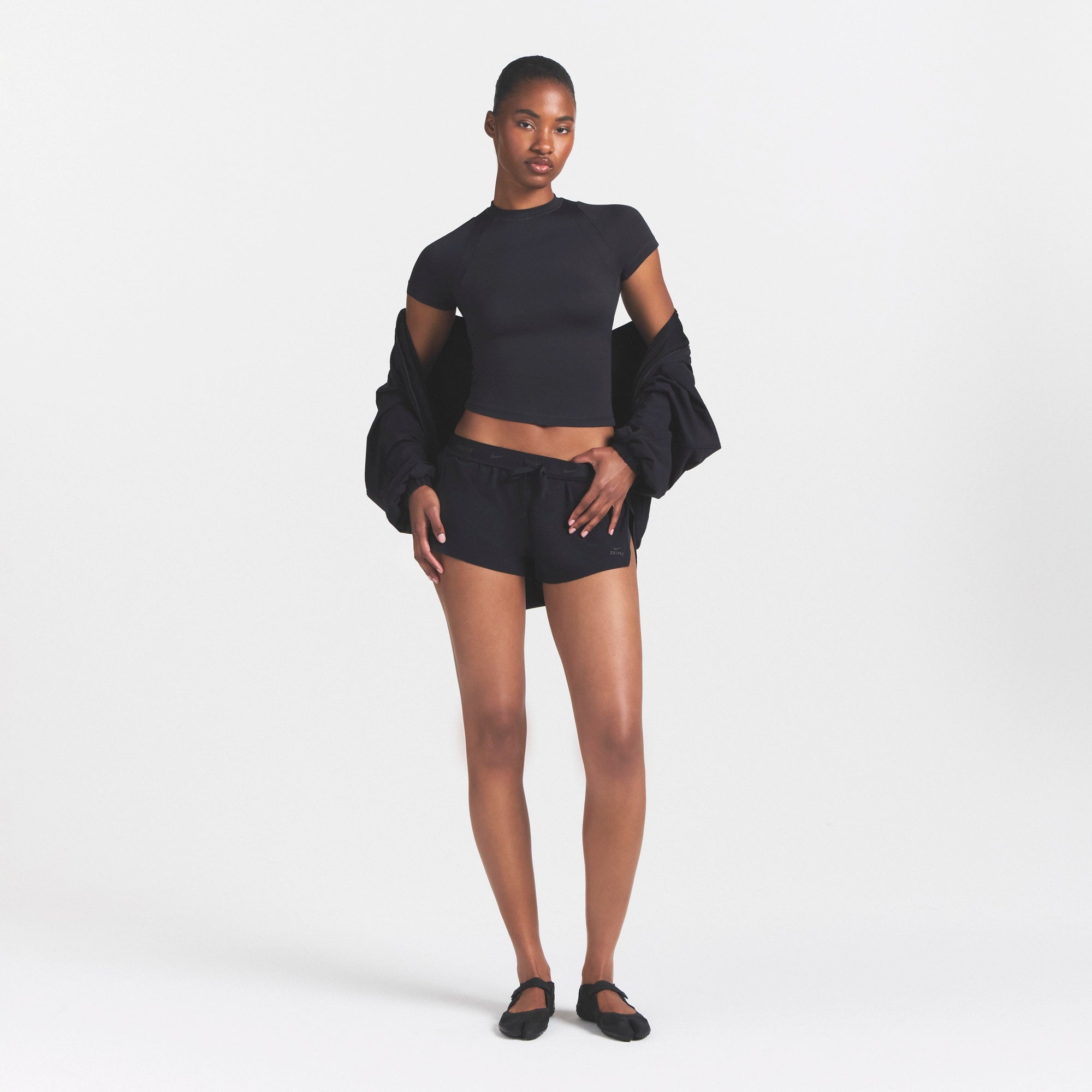 NikeSKIMS STRETCH NYLON RUNNER SHORT | OBSIDIAN ON A MODEL VIEW @ | FOCUS: 0.0, 1.0, 0.9