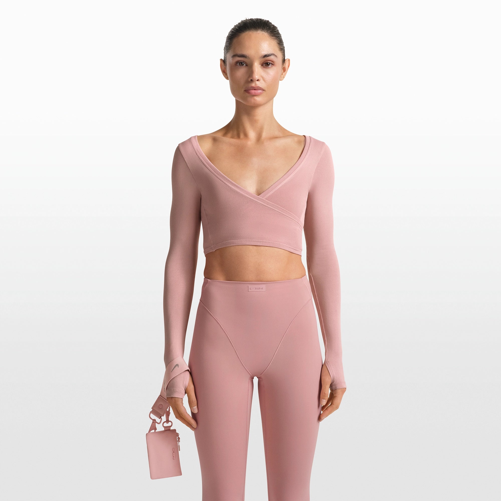 NikeSKIMS ACCESSORIES CLIPPABLE POUCH | HIMALAYAN ON A MODEL FRONT VIEW @ | FOCUS: 0.0, 1.0, 0.9