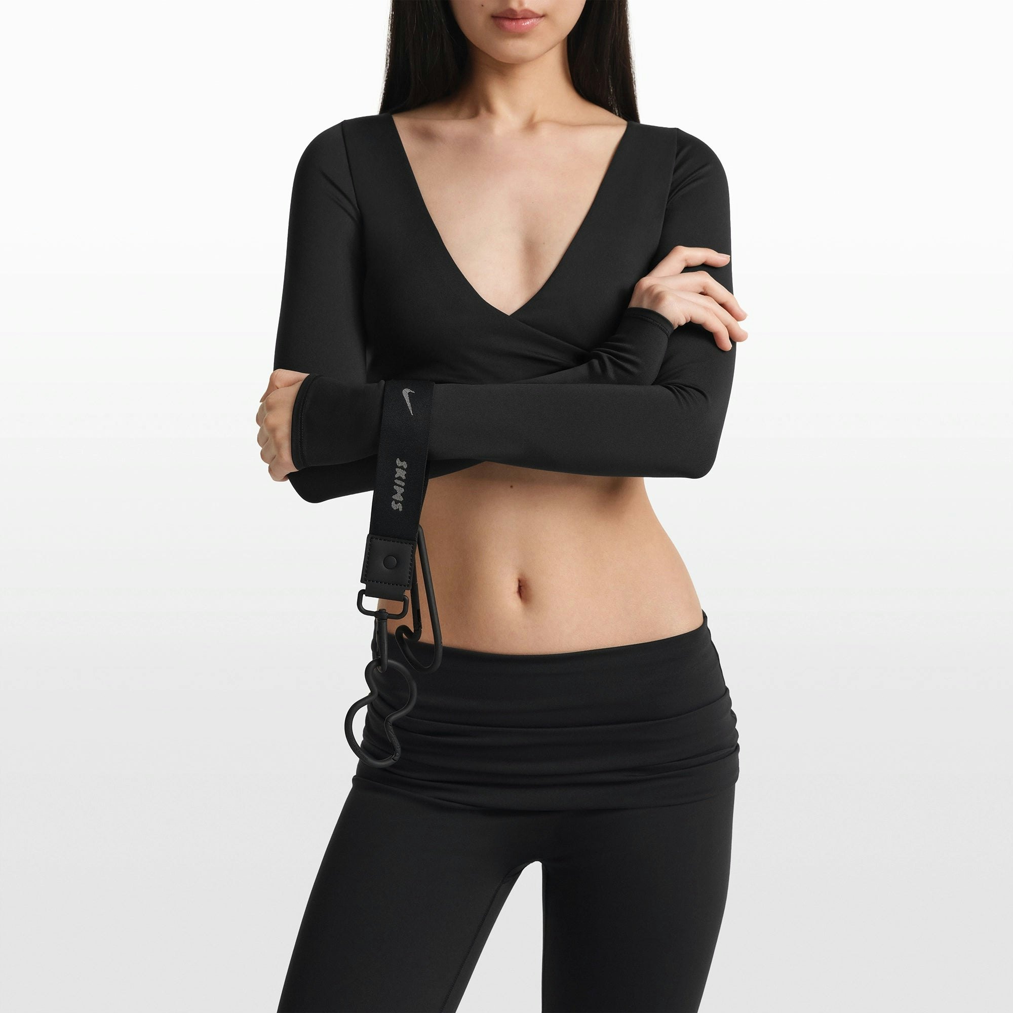 NikeSKIMS ACCESSORIES CARABINER SET | OBSIDIAN ON A MODEL FRONT VIEW @ | FOCUS: 0.0, 1.0, 0.9