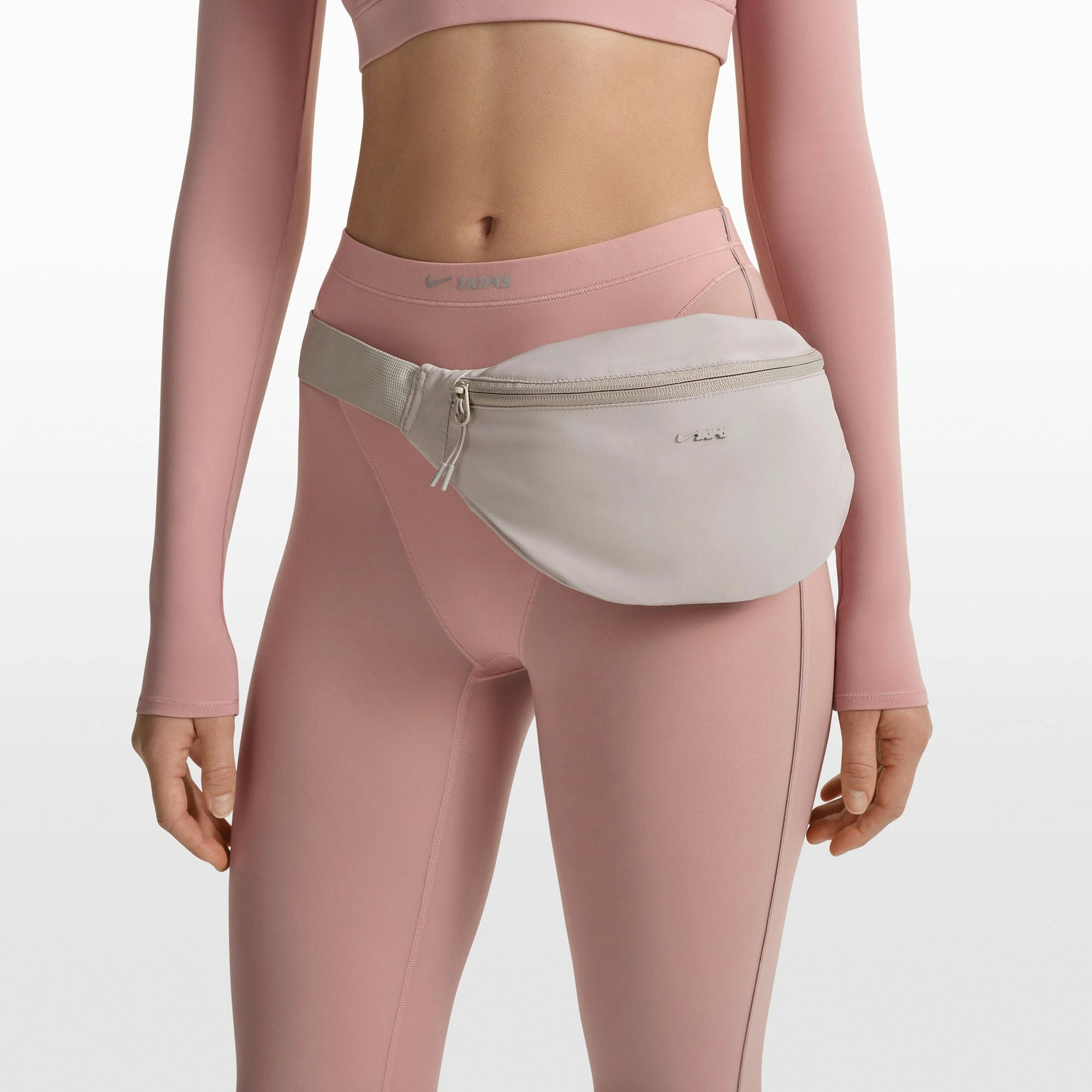 NikeSKIMS ACCESSORIES FANNY PACK | STONE FLAT ON A WHITE BACKGROUND