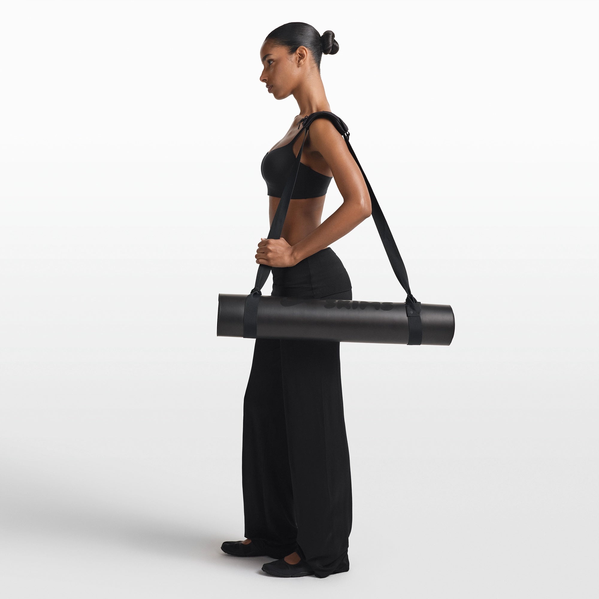 NikeSKIMS ACCESSORIES YOGA MAT STRAP | OBSIDIAN & LAYS FLAT ON A WHITE BACKGROUND | FLT