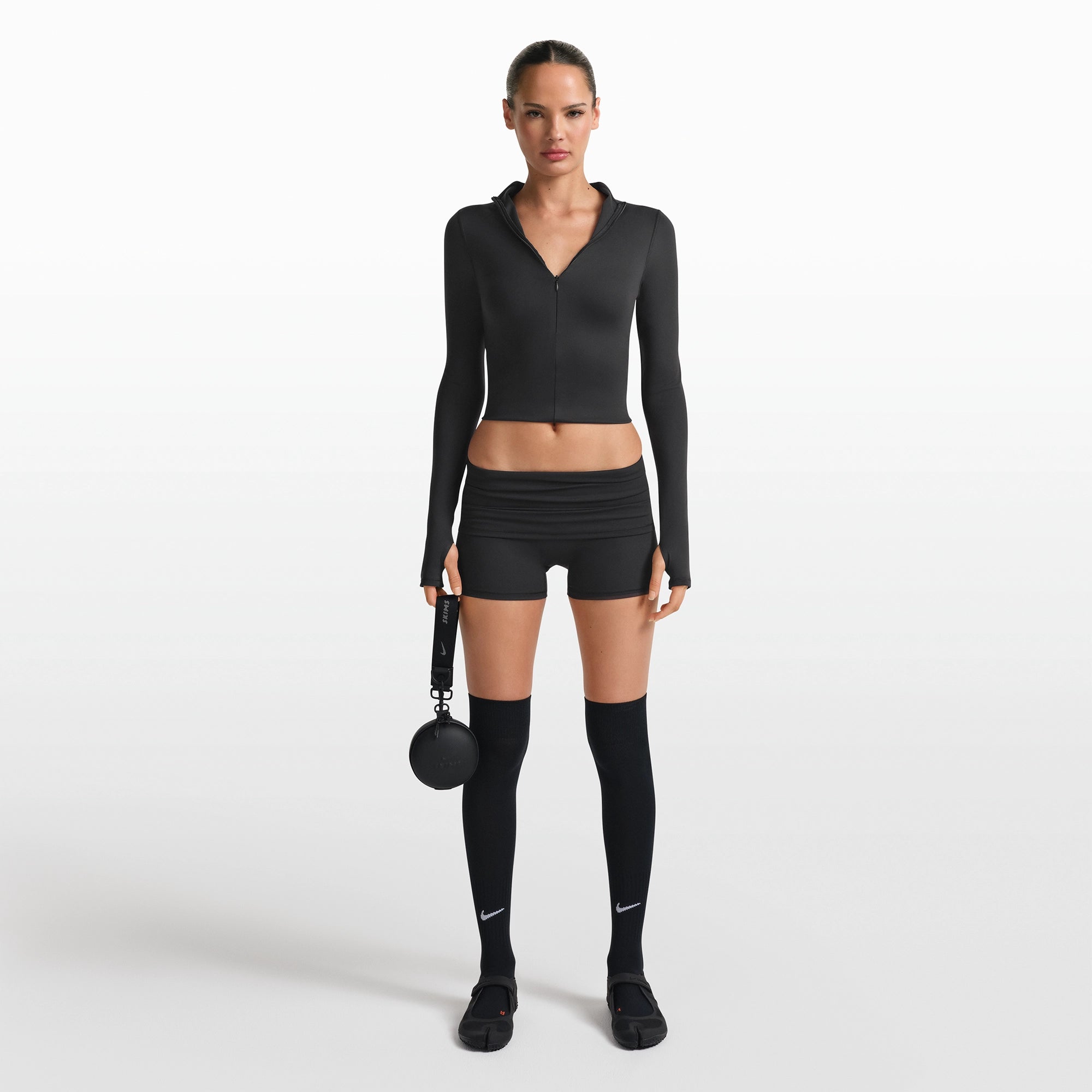 NikeSKIMS ACCESSORIES KEYCHAIN WRISTLET | OBSIDIAN FLAT ON A WHITE BACKGROUND