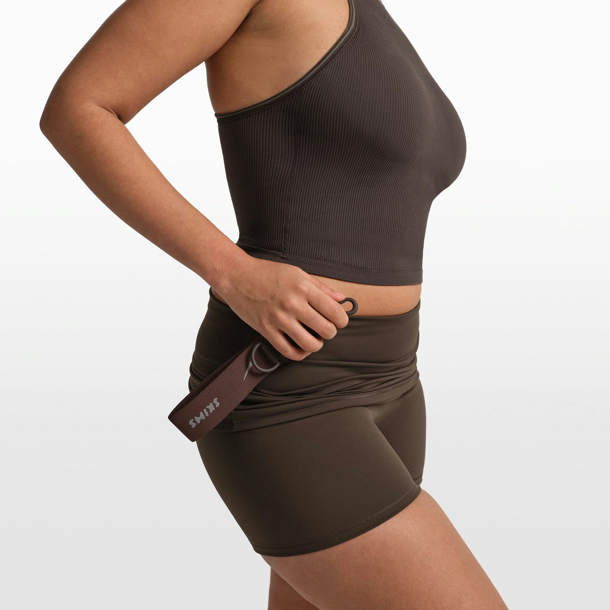 NikeSKIMS ACCESSORIES KEYCHAIN WRISTLET | PHOENIX FLAT ON A WHITE BACKGROUND