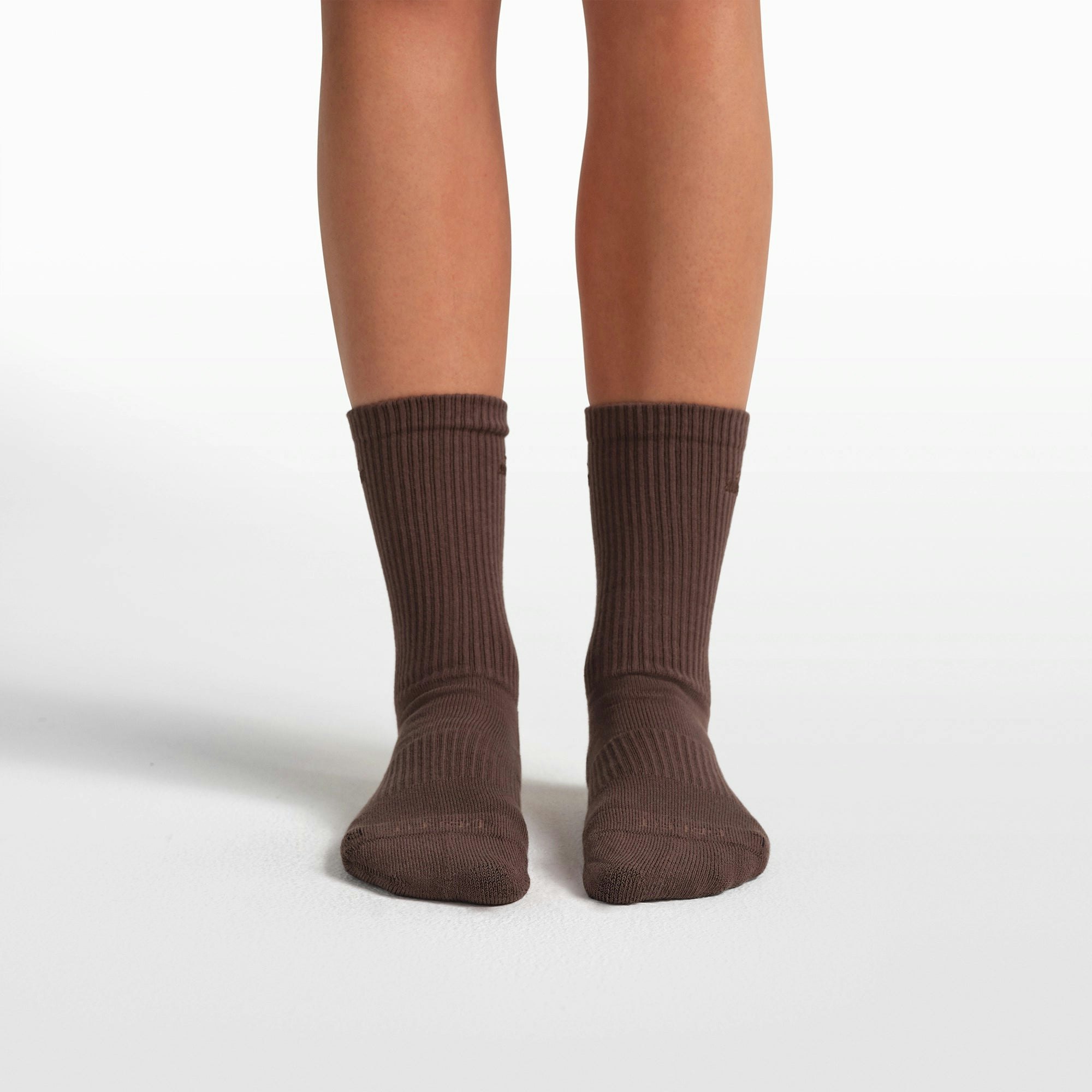 NikeSKIMS ACCESSORIES DRI-FIT PILATES GRIP CREW SOCK | DARK SEPIA FLAT ON A WHITE BACKGROUND