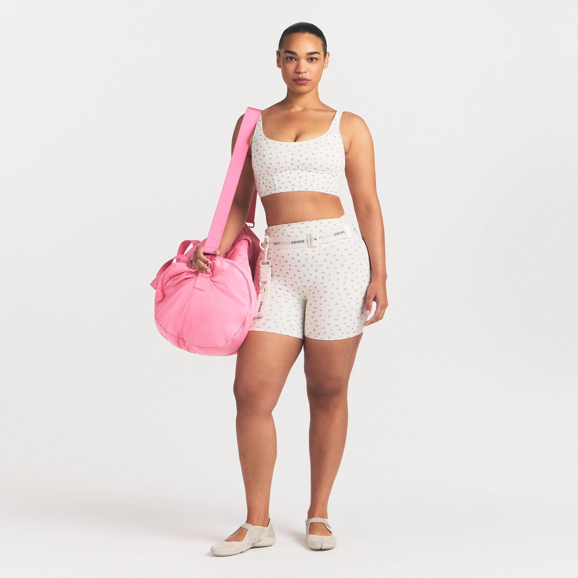 NikeSKIMS MATTE CORSET LONGLINE BRA | DITSY FLORAL PRINT ON A MODEL VIEW @ | FOCUS: 0.0, 1.0, 0.9