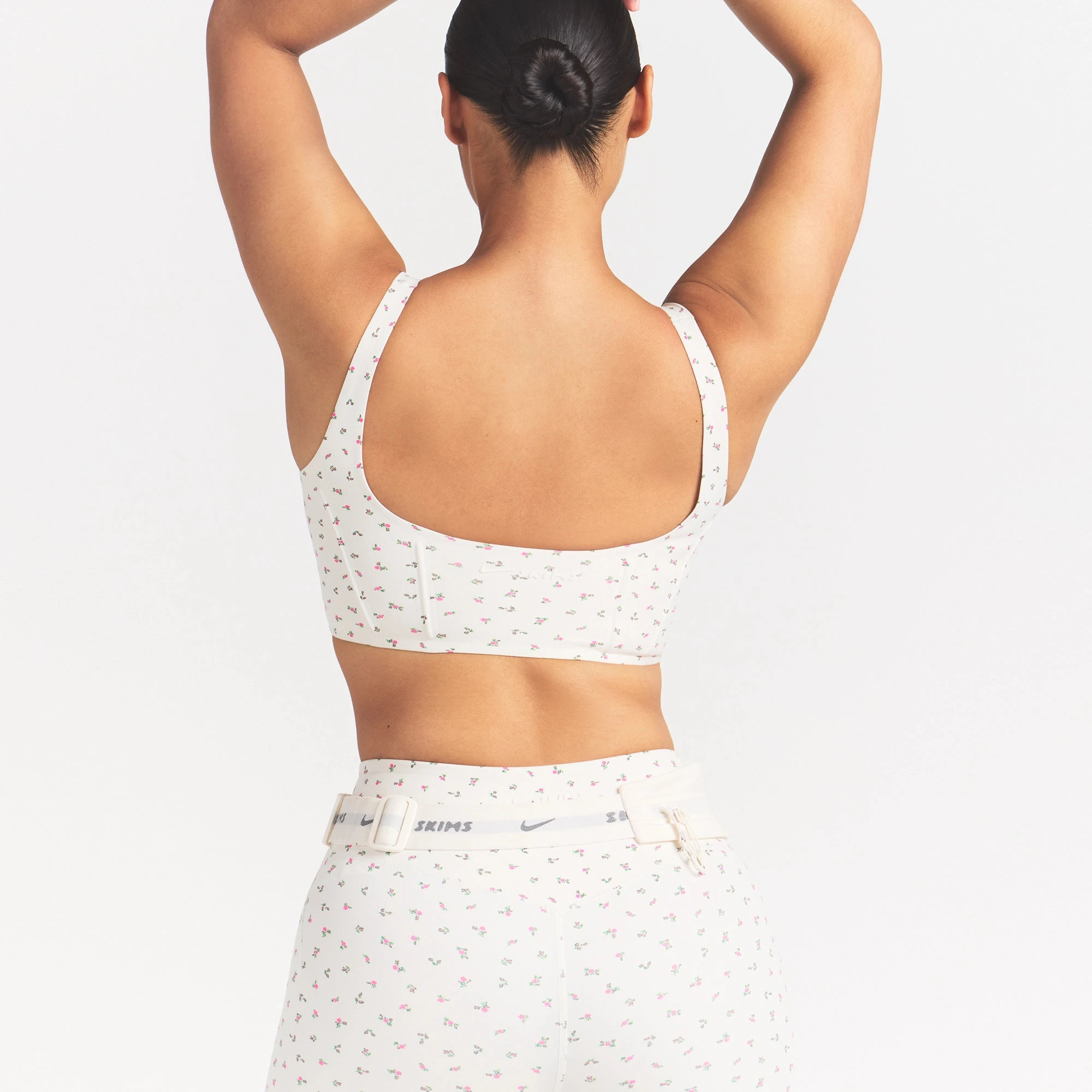 NikeSKIMS MATTE CORSET LONGLINE BRA | DITSY FLORAL PRINT ON A MODEL VIEW @ | FOCUS: 0.0, 1.0, 0.9