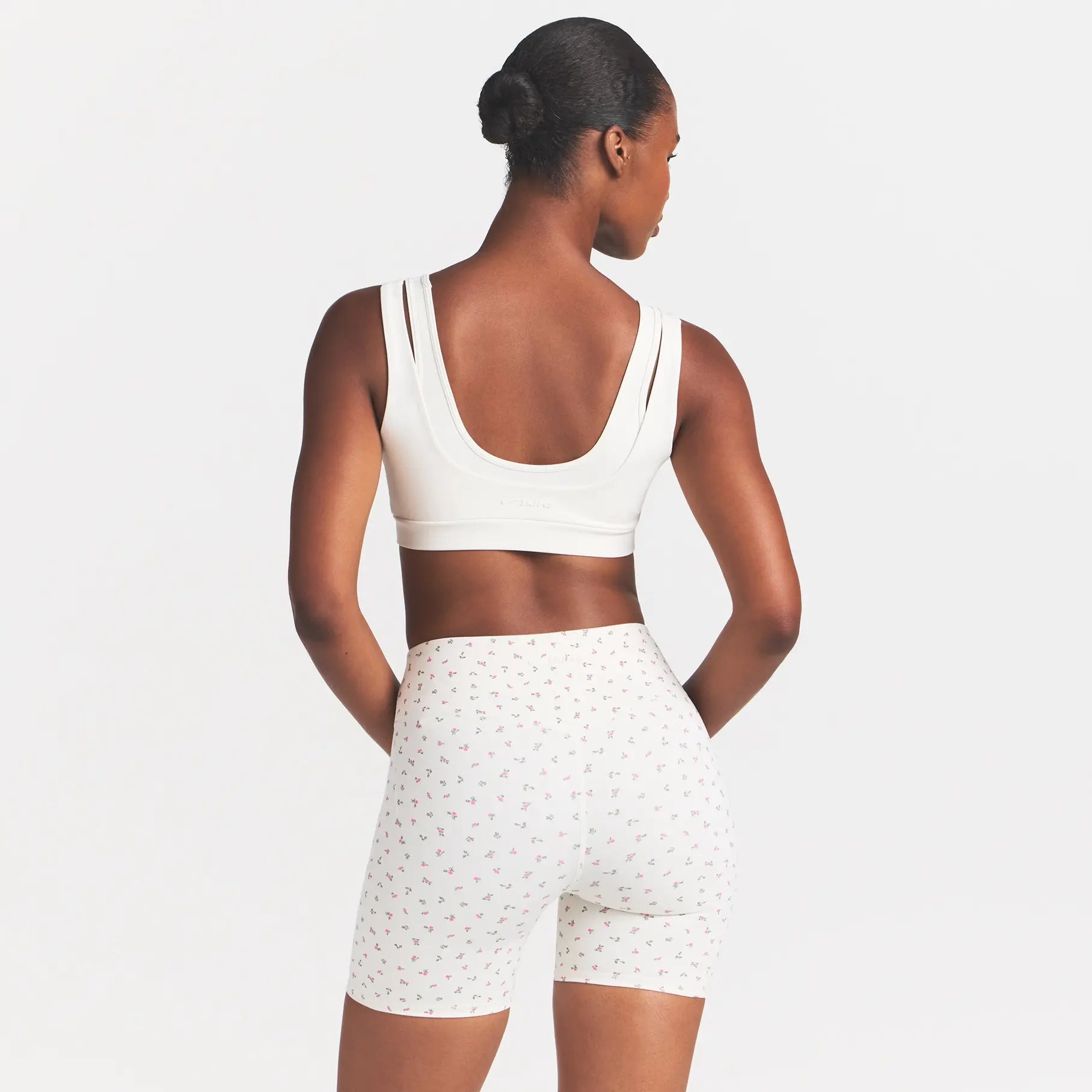 NikeSKIMS MATTE 5" BIKER SHORT | DITSY FLORAL PRINT ON A MODEL VIEW @ | FOCUS: 0.0, 1.0, 0.9
