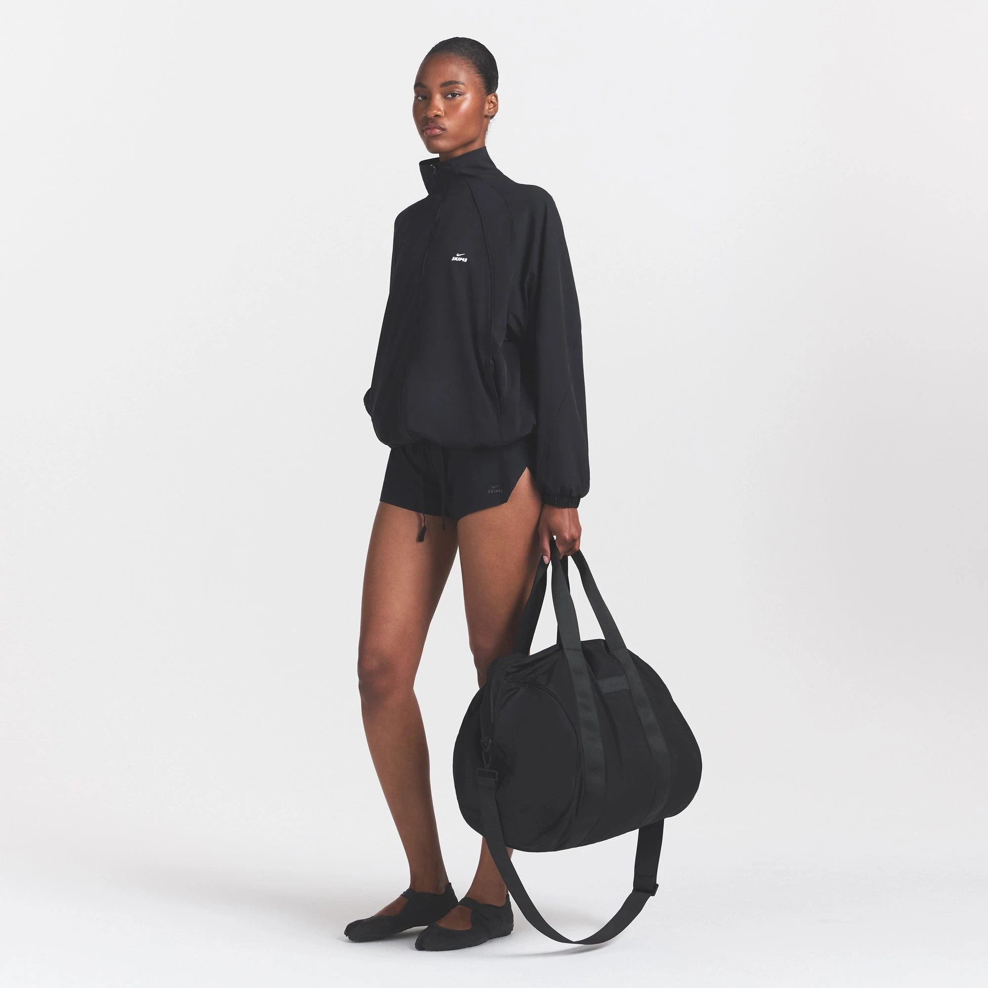 NikeSKIMS ACCESSORIES PUFFER GYM BAG | OBSIDIAN | SKIMS NikeSKIMS ACCESSORIES PUFFER GYM BAG | OBSIDIAN | SKIMS