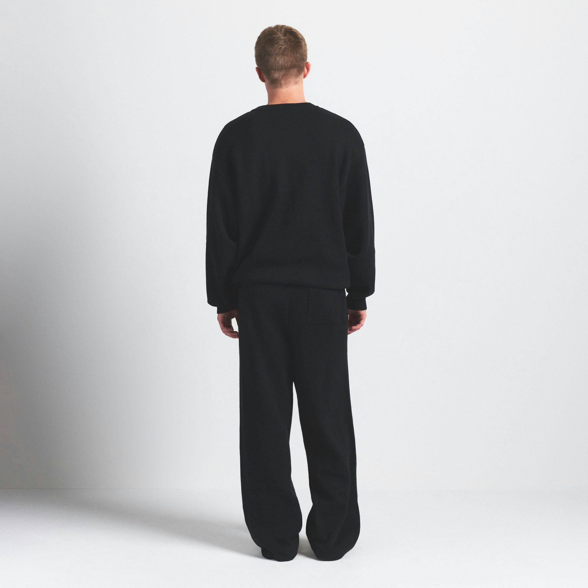 COTTON KNIT MENS STRAIGHT LEG PANT | OBSIDIAN ON A MODEL SIDE VIEW @ | FOCUS: 0.0, 1.0, 0.9