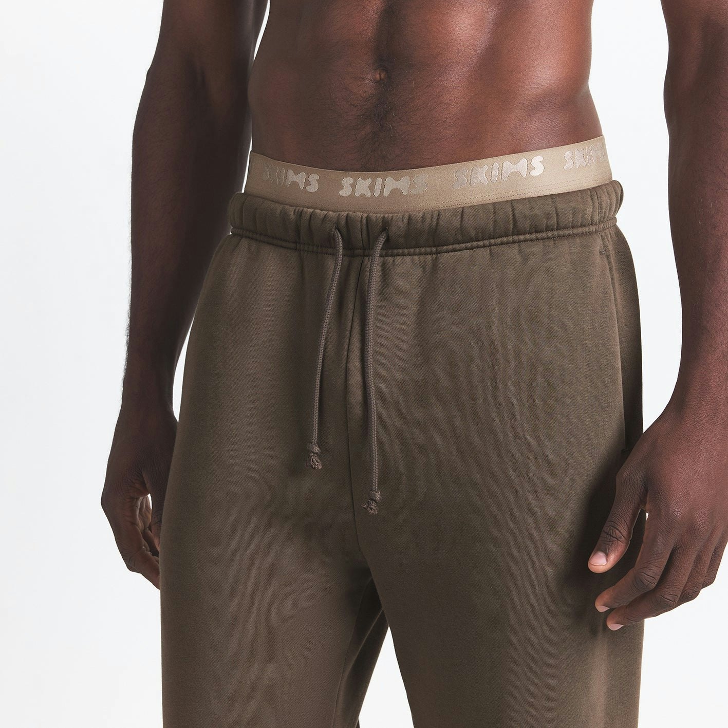 FLEECE LOUNGE MENS RELAXED JOGGER | DRIFTWOOD ON A MODEL FRONT VIEW @ | FOCUS: 0.0, 1.0, 0.9