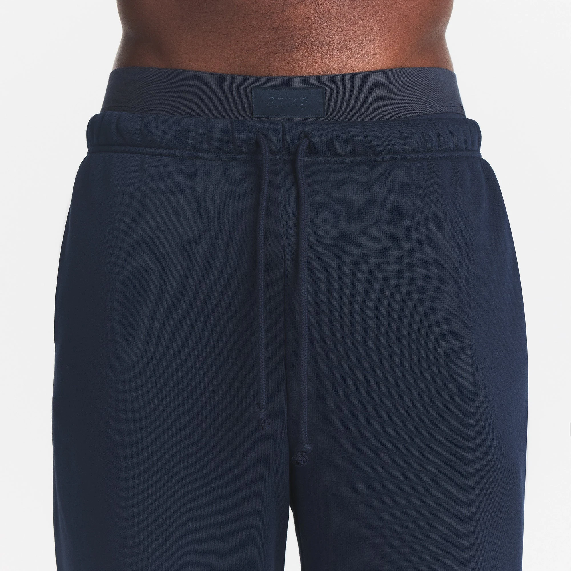 FLEECE LOUNGE MENS RELAXED JOGGER | NAVY ON A MODEL FRONT VIEW | FOCUS: 0.0, 1.0, 0.9