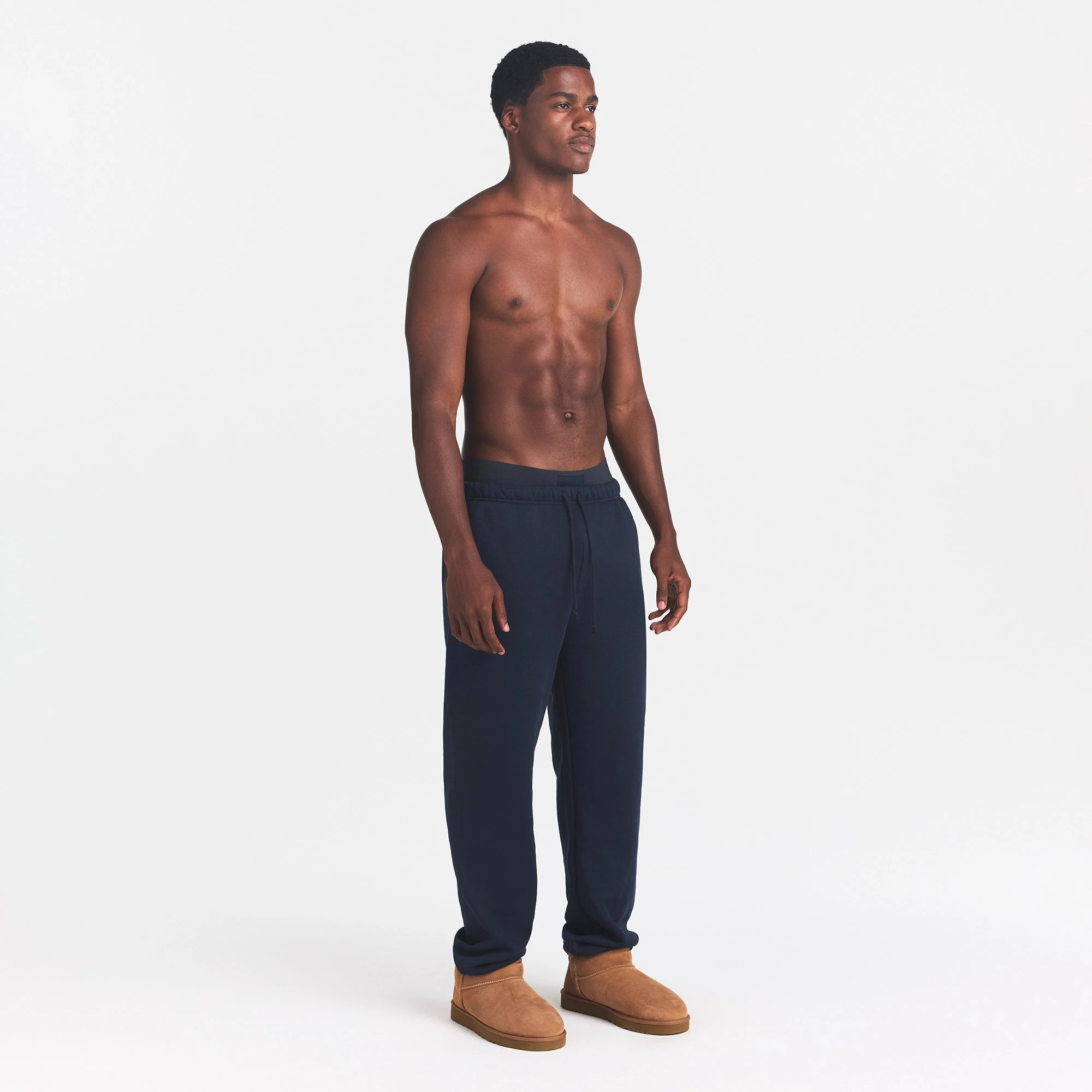 FLEECE LOUNGE MENS RELAXED JOGGER | NAVY ON A MODEL SIDE VIEW | FOCUS: 0.0, 1.0, 0.9