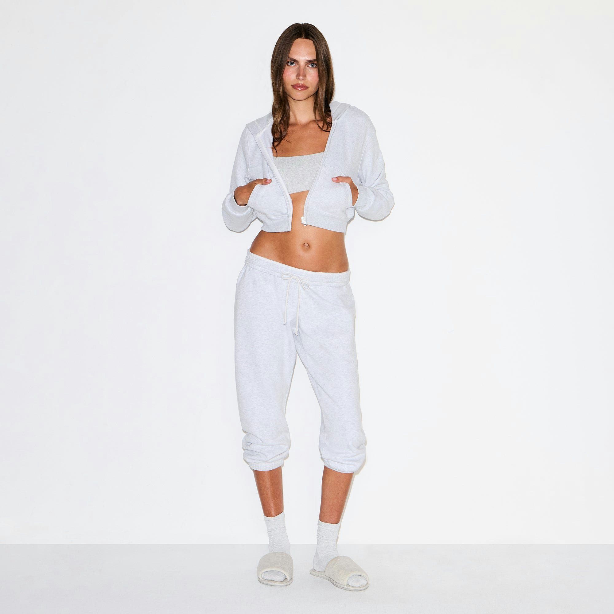 COTTON FLEECE LOW RISE CAPRI JOGGER | LIGHT HEATHER GREY ON A MODEL FRONT VIEW @ | FOCUS: 0.0, 1.0, 0.9