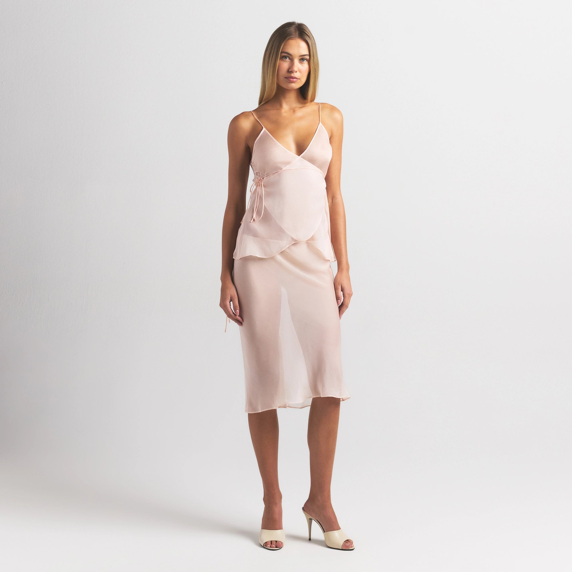 SKIMS ROMANCE MIDI SKIRT | PRIMROSE ON A MODEL FRONT VIEW @ | FOCUS: 0.0, 1.0, 0.9