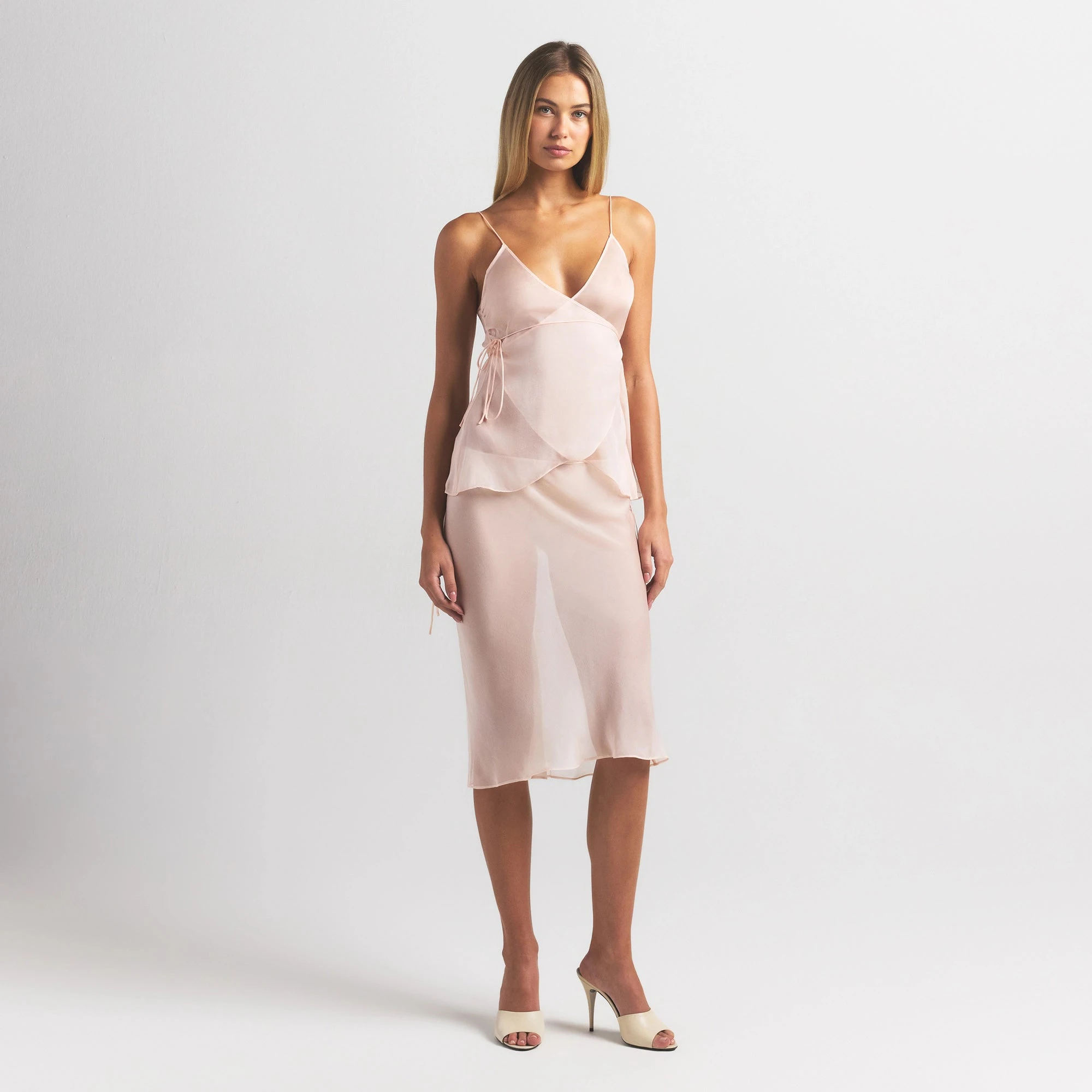 SKIMS ROMANCE MIDI SKIRT | PRIMROSE ON A MODEL FRONT VIEW @ | FOCUS: 0.0, 1.0, 0.9