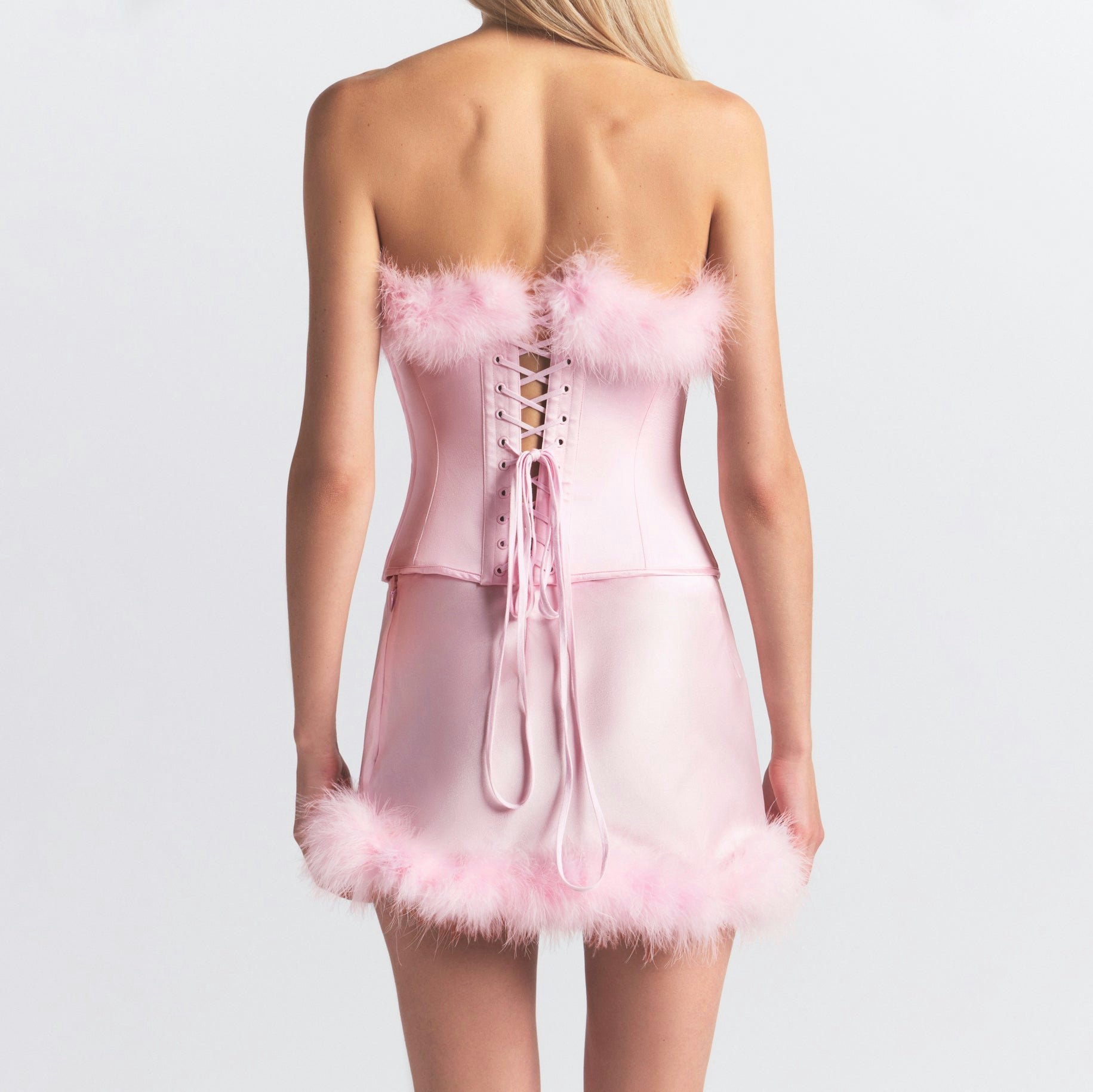 SILK FEATHER TRIM LOW RISE MINI SKIRT | CHERRY BLOSSOM ON A MODEL SIDE VIEW @ | FOCUS: 0.0, 1.0, 0.9