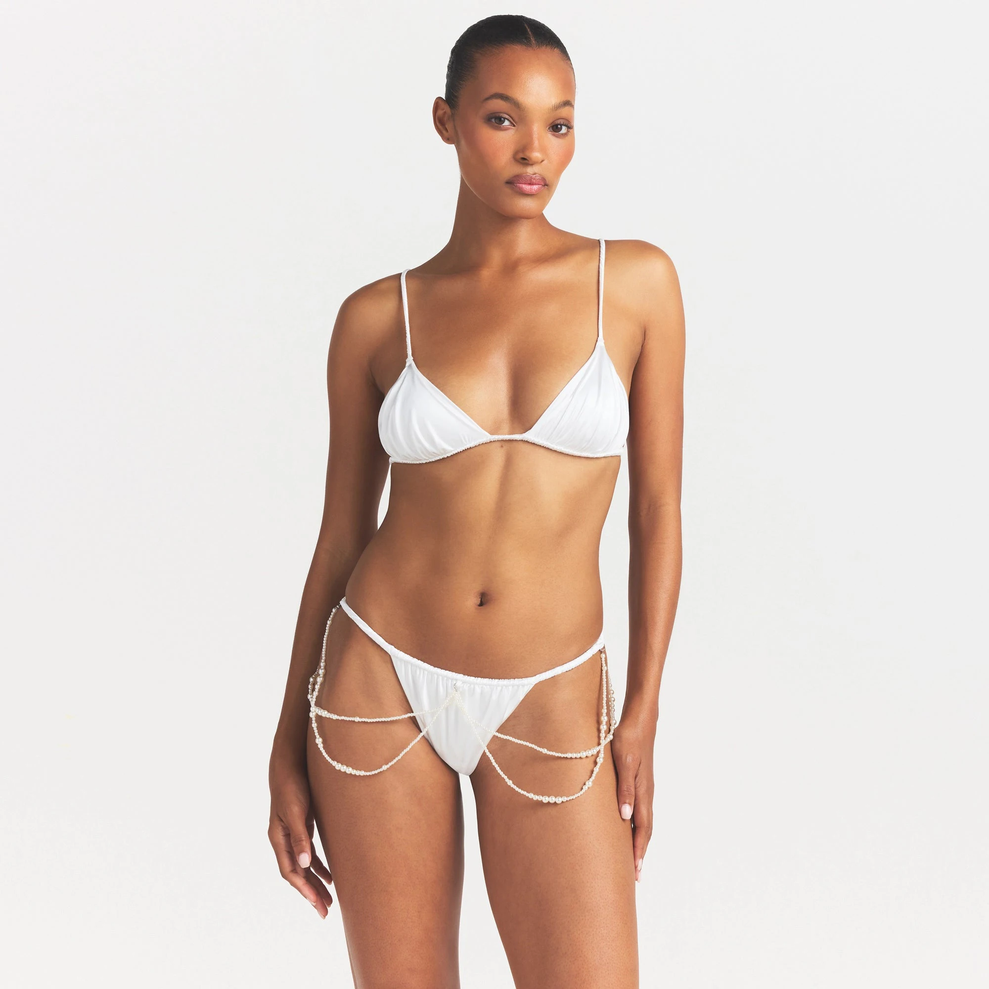 NOVELTY INTIMATES PEARL BRALETTE AND THONG SET | SNOW ON A MODEL SIDE VIEW