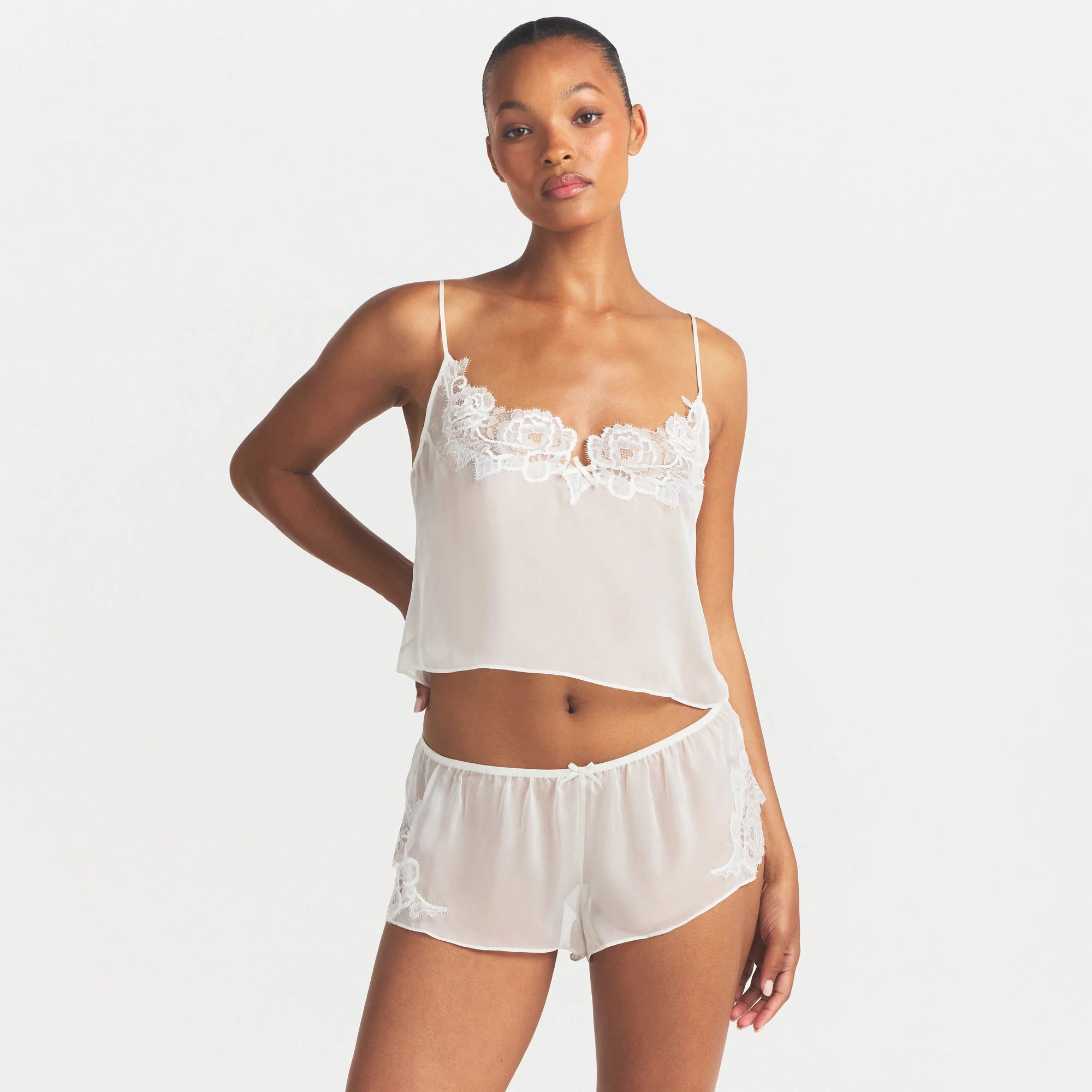 SKIMS ROMANCE CAMI AND SHORT SET | IVORY ON A MODEL SIDE VIEW @ | FOCUS: 0.0, 1.0, 0.9