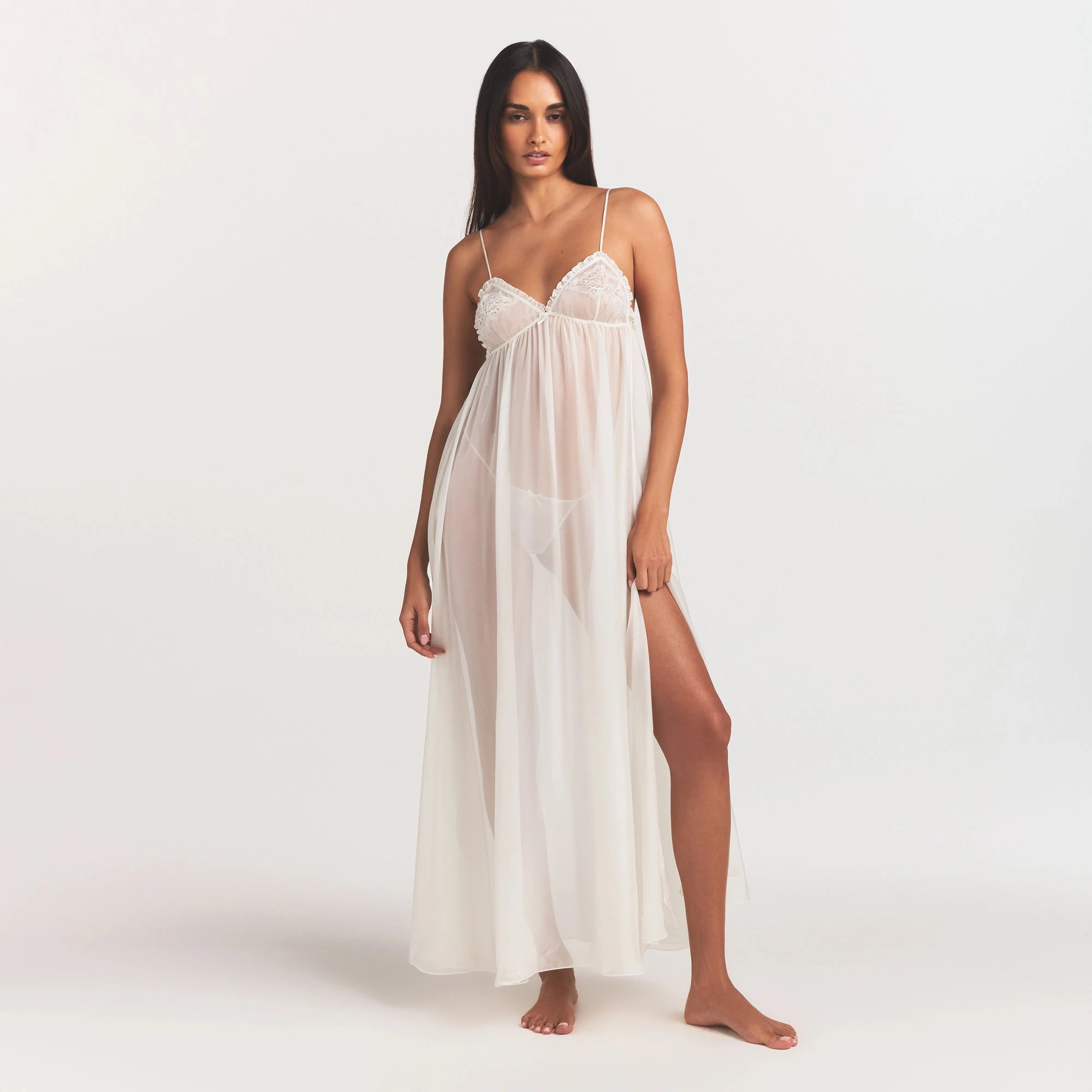 SKIMS ROMANCE LONG SLIP | IVORY ON A MODEL FRONT VIEW @ | FOCUS: 0.0, 1.0, 0.9