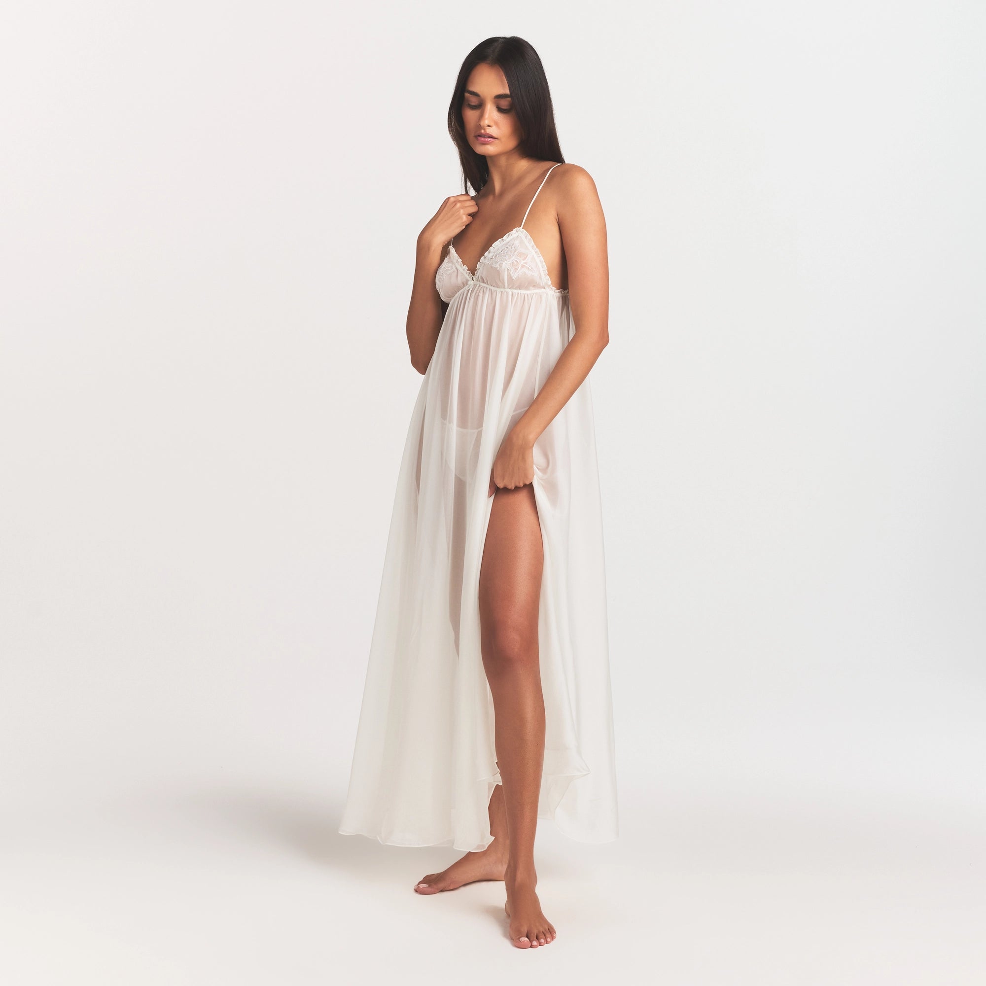 SKIMS ROMANCE LONG SLIP | IVORY ON A MODEL FRONT VIEW @ | FOCUS: 0.0, 1.0, 0.9