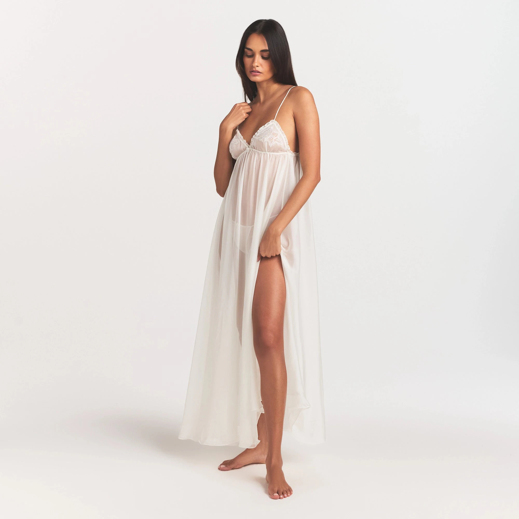 SKIMS ROMANCE LONG SLIP | IVORY ON A MODEL FRONT VIEW @ | FOCUS: 0.0, 1.0, 0.9