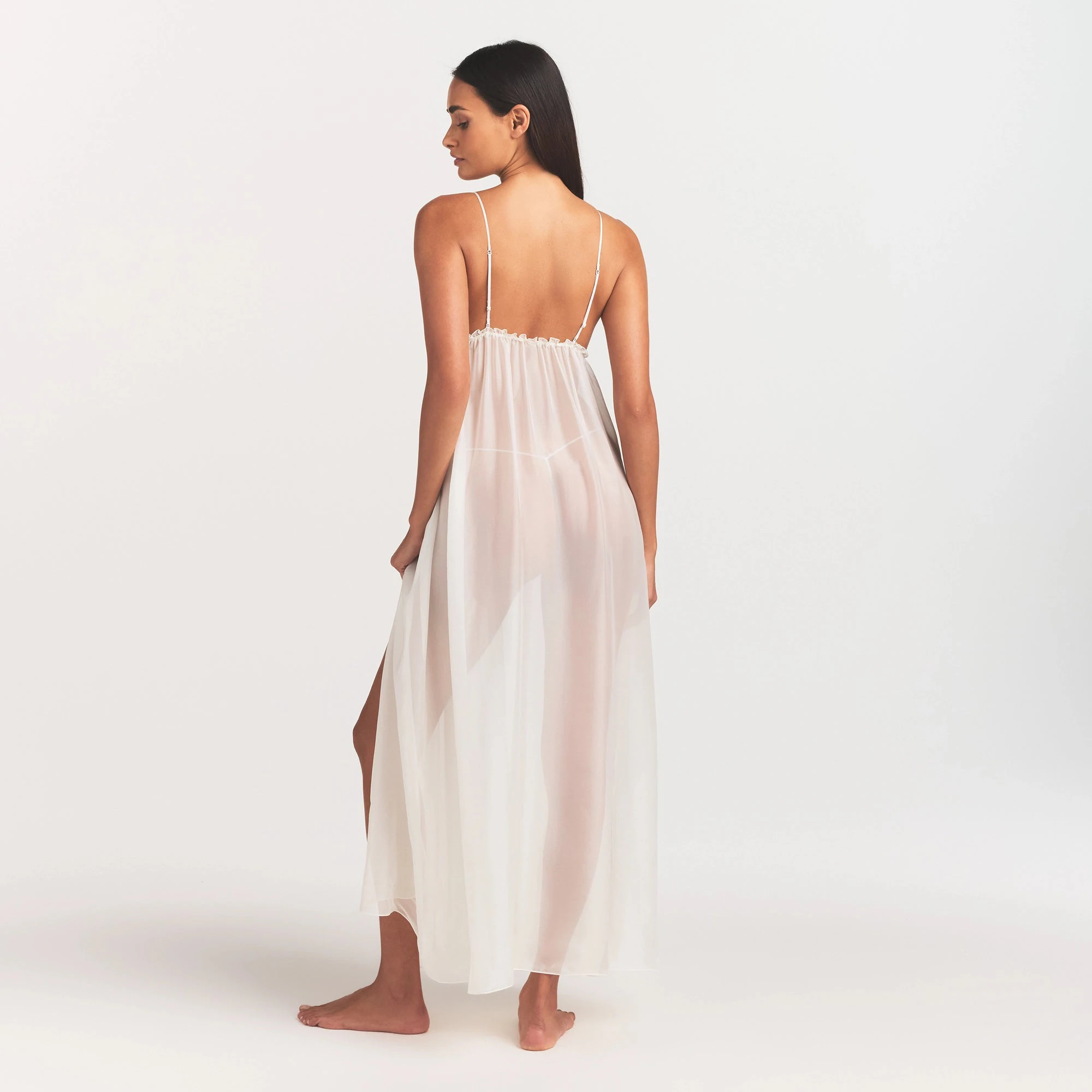 SKIMS ROMANCE LONG SLIP | IVORY ON A MODEL FRONT VIEW @ | FOCUS: 0.0, 1.0, 0.9