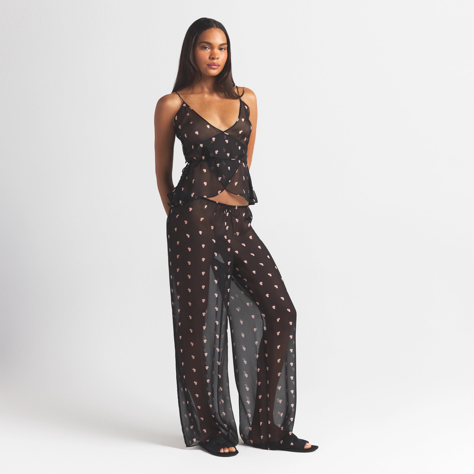 SKIMS ROMANCE WRAP CAMI TOP | OBSIDIAN SPACED HEARTS ON A MODEL FRONT VIEW @ | FOCUS: 0.0, 1.0, 0.9