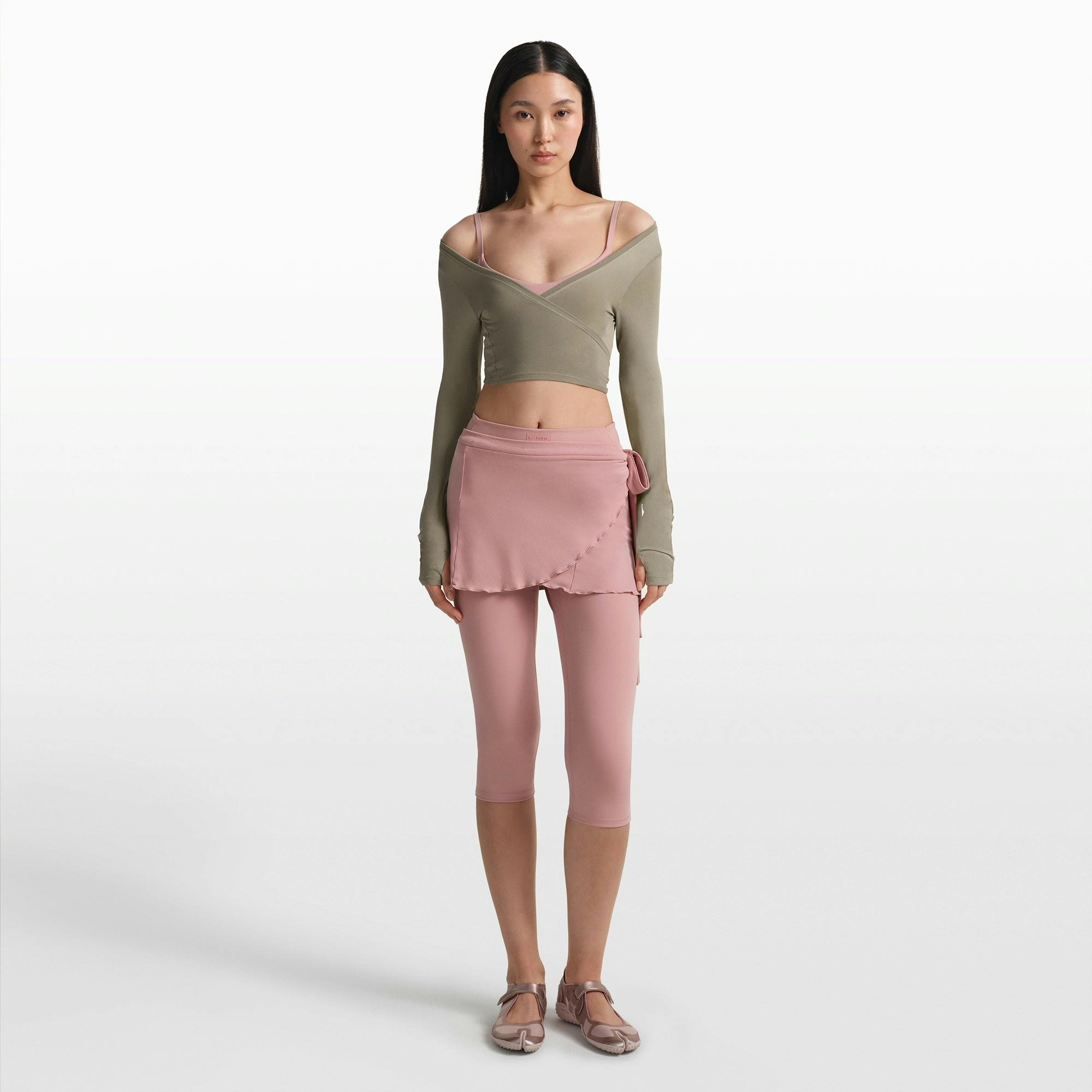 NikeSKIMS STRETCH KNIT WRAP LONG SLEEVE CROPPED TOP | DUNE ON A MODEL FRONT VIEW @ | FOCUS: 0.0, 1.0, 0.9
