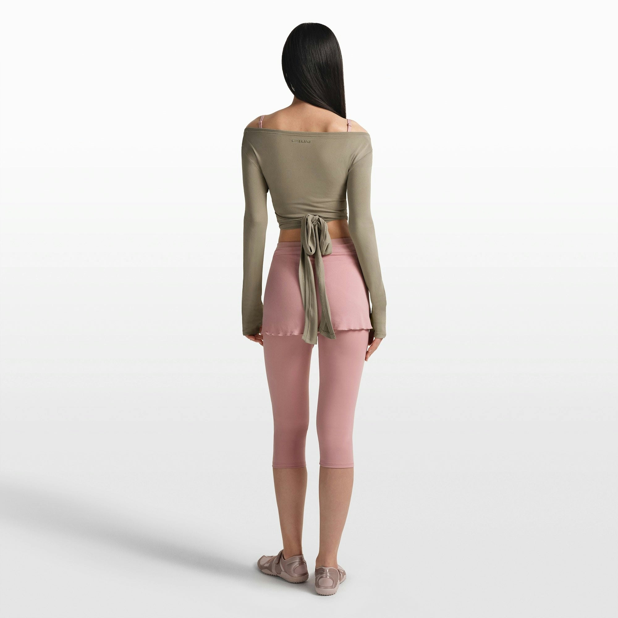 NikeSKIMS STRETCH KNIT WRAP LONG SLEEVE CROPPED TOP | DUNE ON A MODEL FRONT VIEW @ | FOCUS: 0.0, 1.0, 0.9