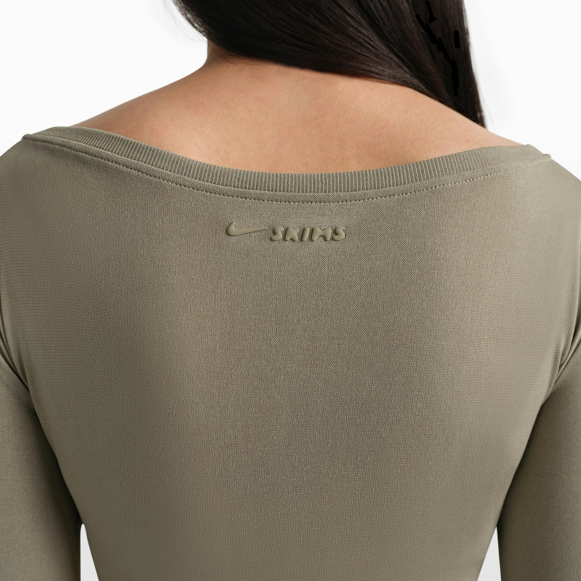 NikeSKIMS STRETCH KNIT WRAP LONG SLEEVE CROPPED TOP | DUNE ON A MODEL FRONT VIEW @ | FOCUS: 0.0, 1.0, 0.9