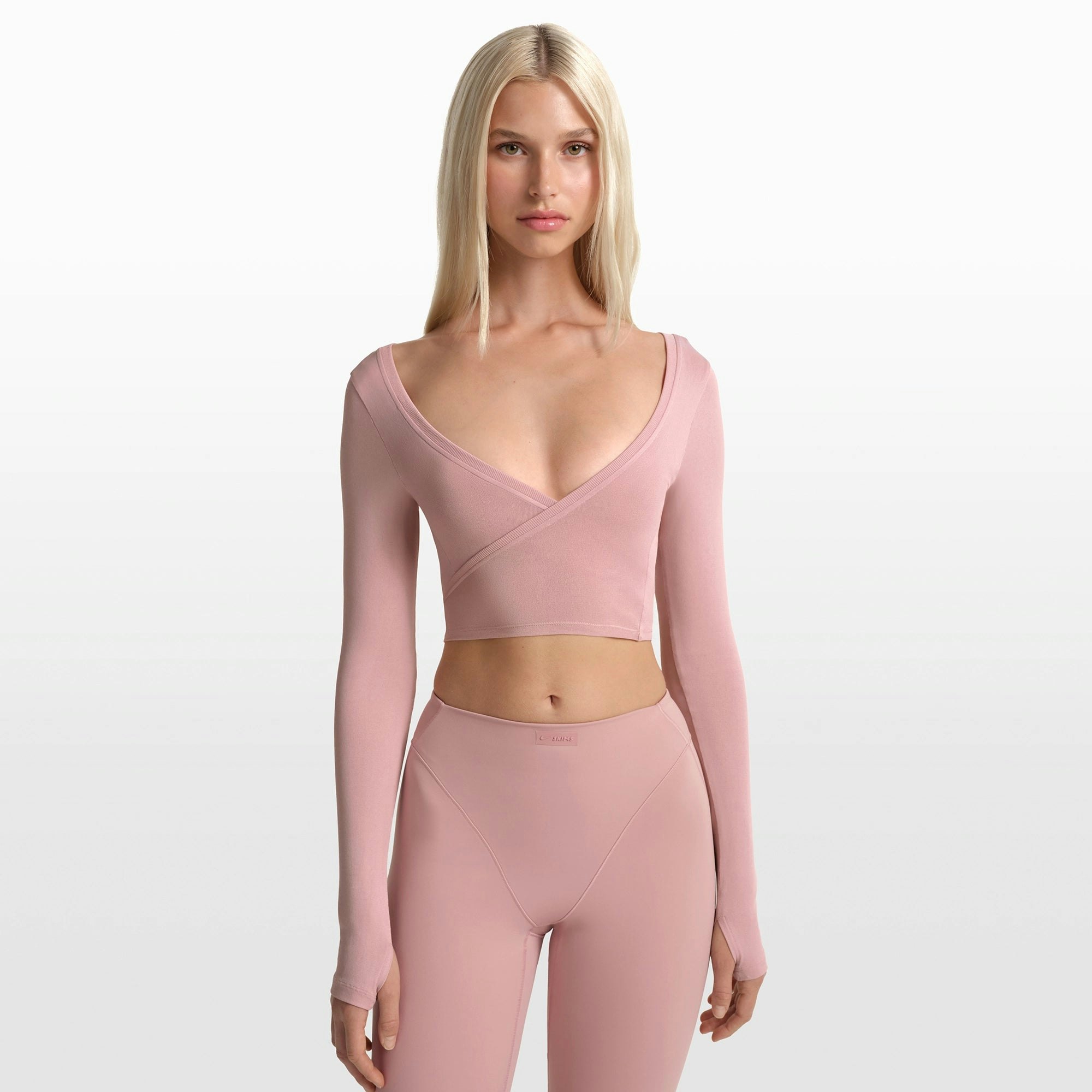 NikeSKIMS STRETCH KNIT WRAP LONG SLEEVE CROPPED TOP | HIMALAYAN ON A MODEL FRONT VIEW @ | FOCUS: 0.0, 1.0, 0.9