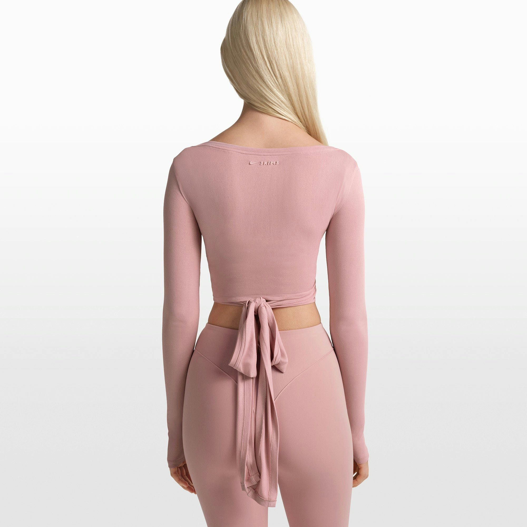 NikeSKIMS STRETCH KNIT WRAP LONG SLEEVE CROPPED TOP | HIMALAYAN ON A MODEL FRONT VIEW @ | FOCUS: 0.0, 1.0, 0.9