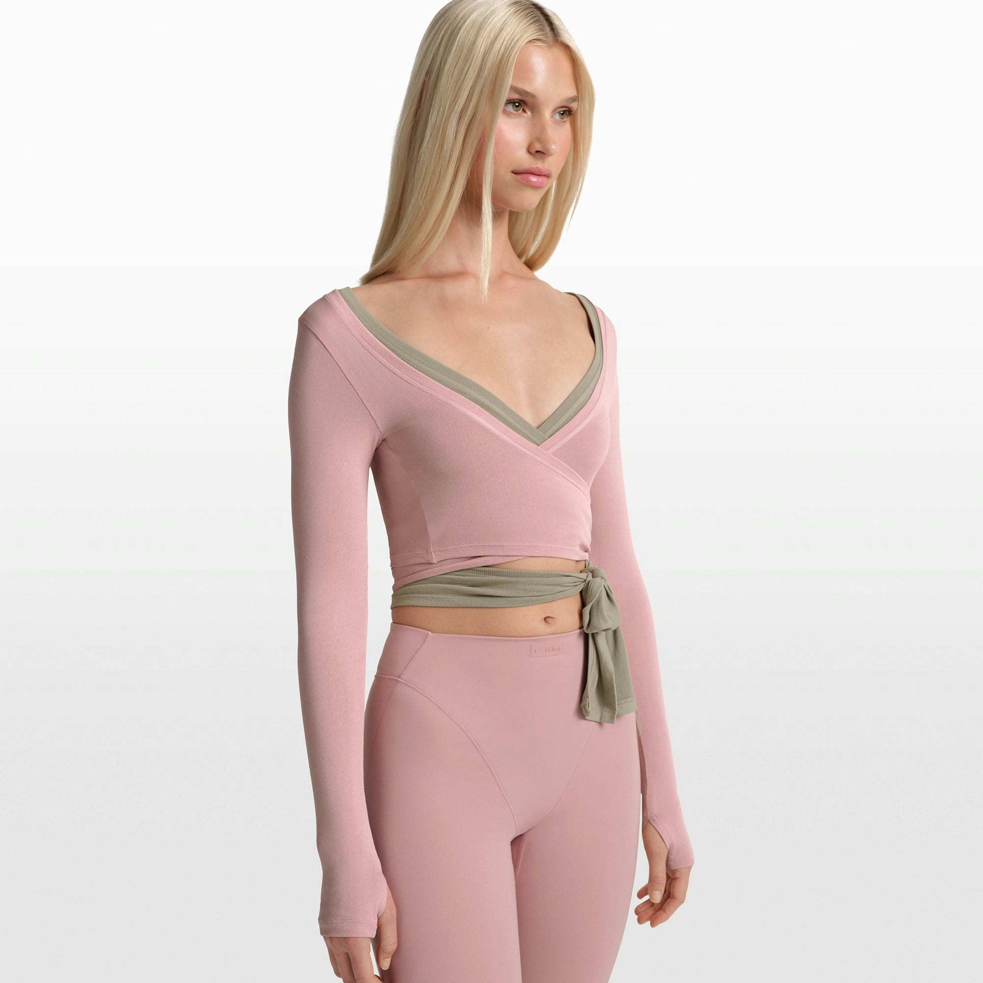 NikeSKIMS STRETCH KNIT WRAP LONG SLEEVE CROPPED TOP | HIMALAYAN ON A MODEL FRONT VIEW @ | FOCUS: 0.0, 1.0, 0.9