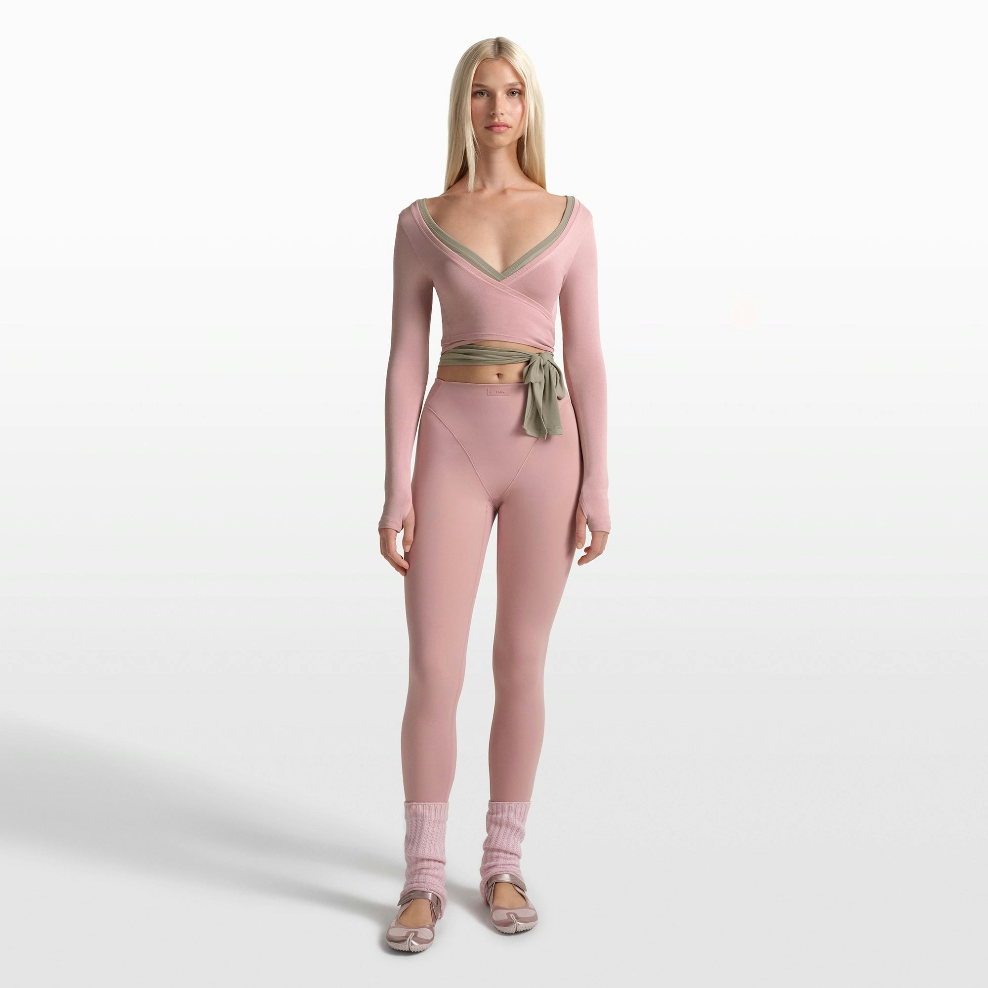 NikeSKIMS STRETCH KNIT WRAP LONG SLEEVE CROPPED TOP | HIMALAYAN ON A MODEL FRONT VIEW @ | FOCUS: 0.0, 1.0, 0.9