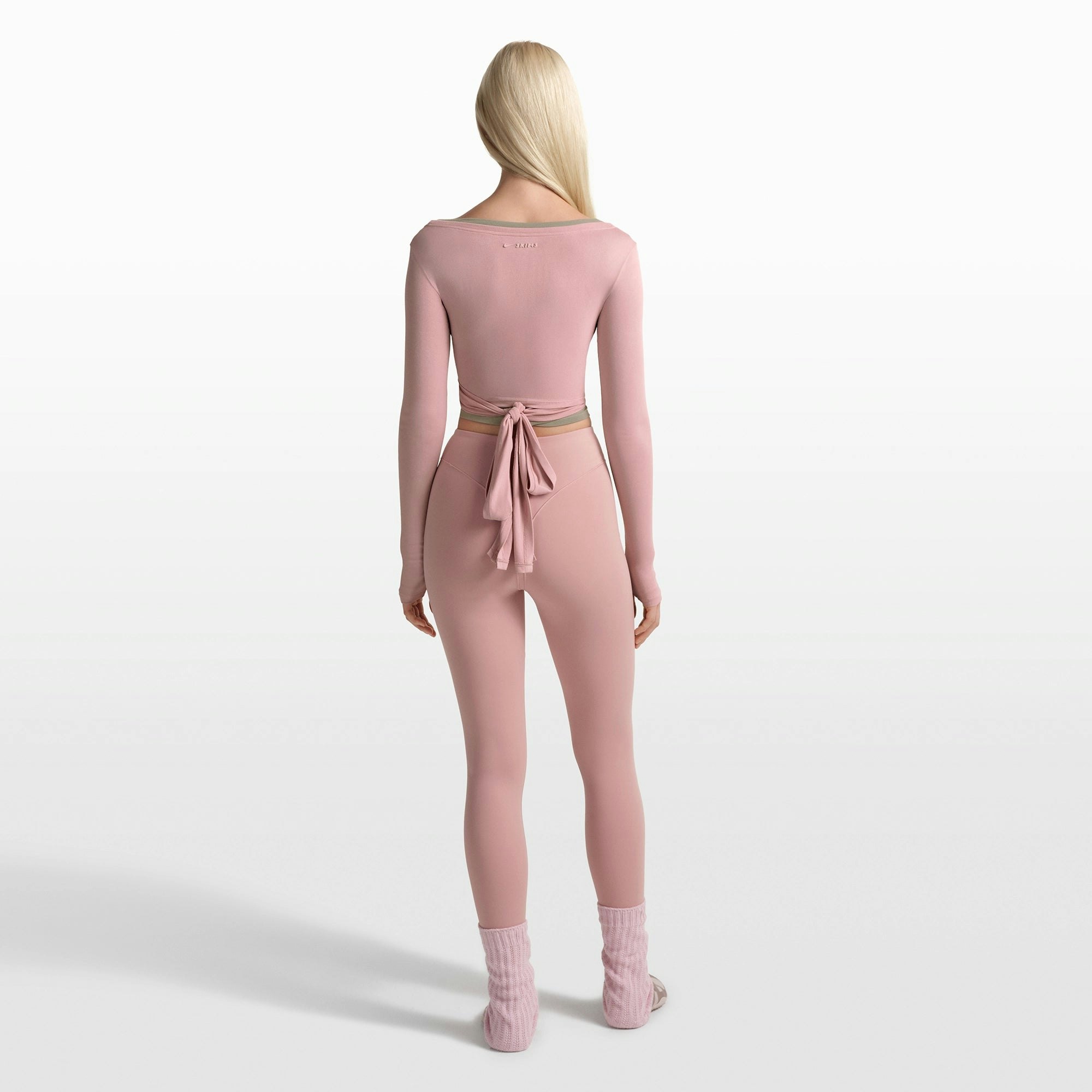 NikeSKIMS STRETCH KNIT WRAP LONG SLEEVE CROPPED TOP | HIMALAYAN ON A MODEL FRONT VIEW @ | FOCUS: 0.0, 1.0, 0.9