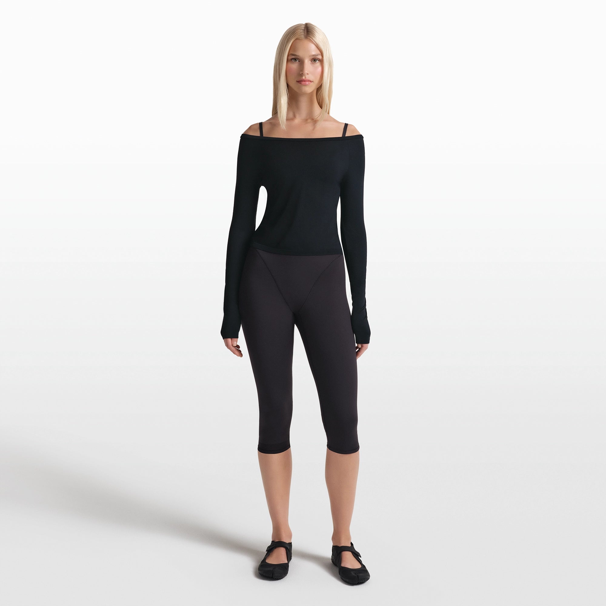 NikeSKIMS STRETCH KNIT LONG SLEEVE BOATNECK TOP | OBSIDIAN ON A MODEL FRONT VIEW @ | FOCUS: 0.0, 1.0, 0.9